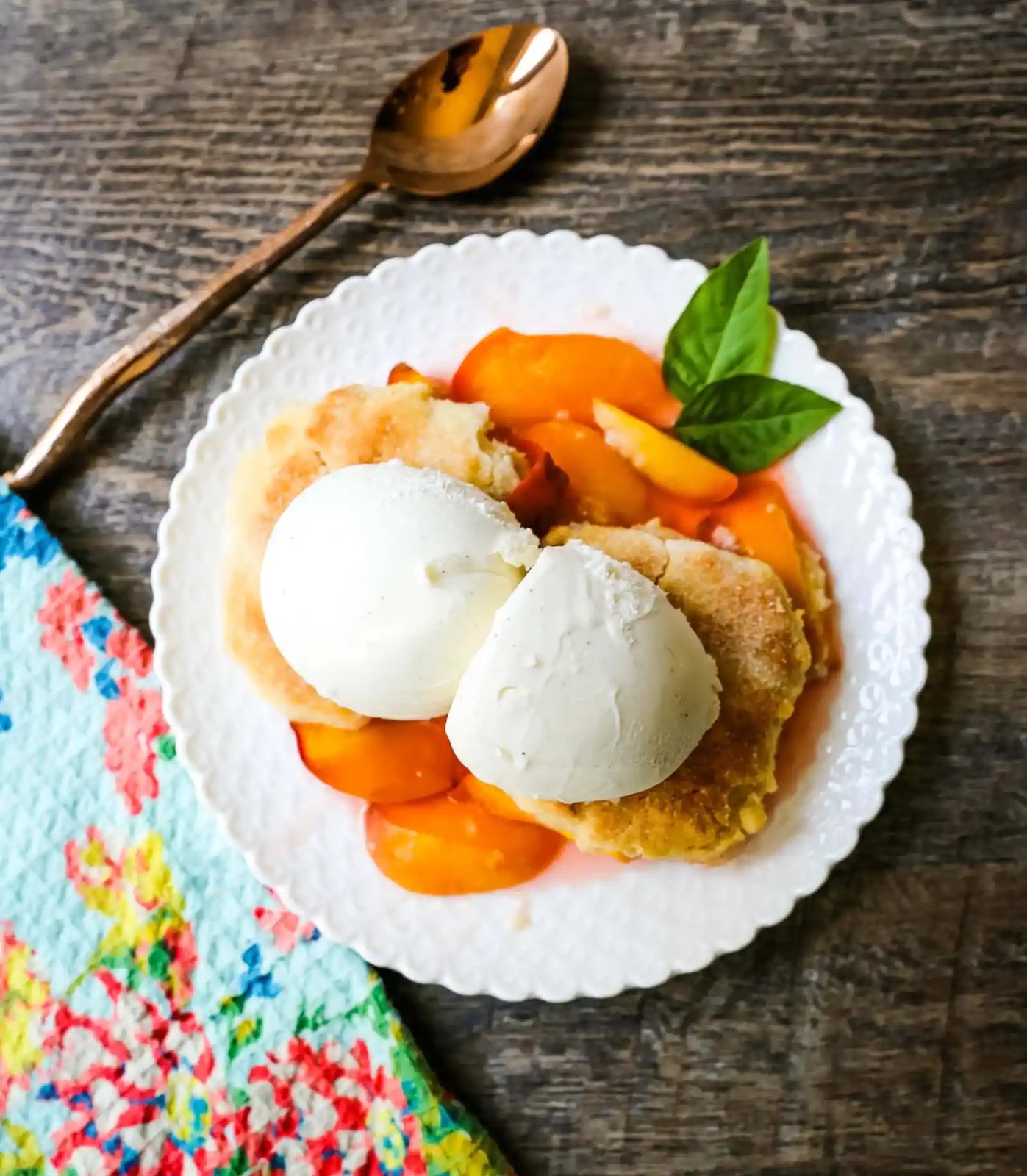 Peach Cobbler. The Best Peach Cobbler Recipe! Fresh peaches tossed with a touch of sugar and topped with a homemade sweet and buttery topping that resembles a mix of a sugar cookie and a sweet biscuit.