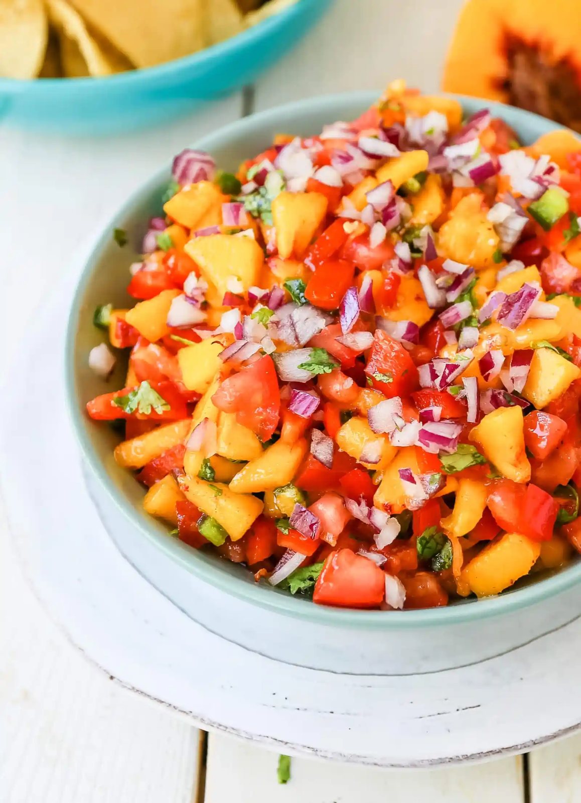 Peach Salsa. Fresh peach salsa with red pepper, jalapeño, red onion, tomatoes, cilantro, and fresh lime juice. A sweet and savory salsa perfect to pair with chips, grilled chicken or pork. www.modernhoney.com #peachsalsa #salsa #peachrecipes