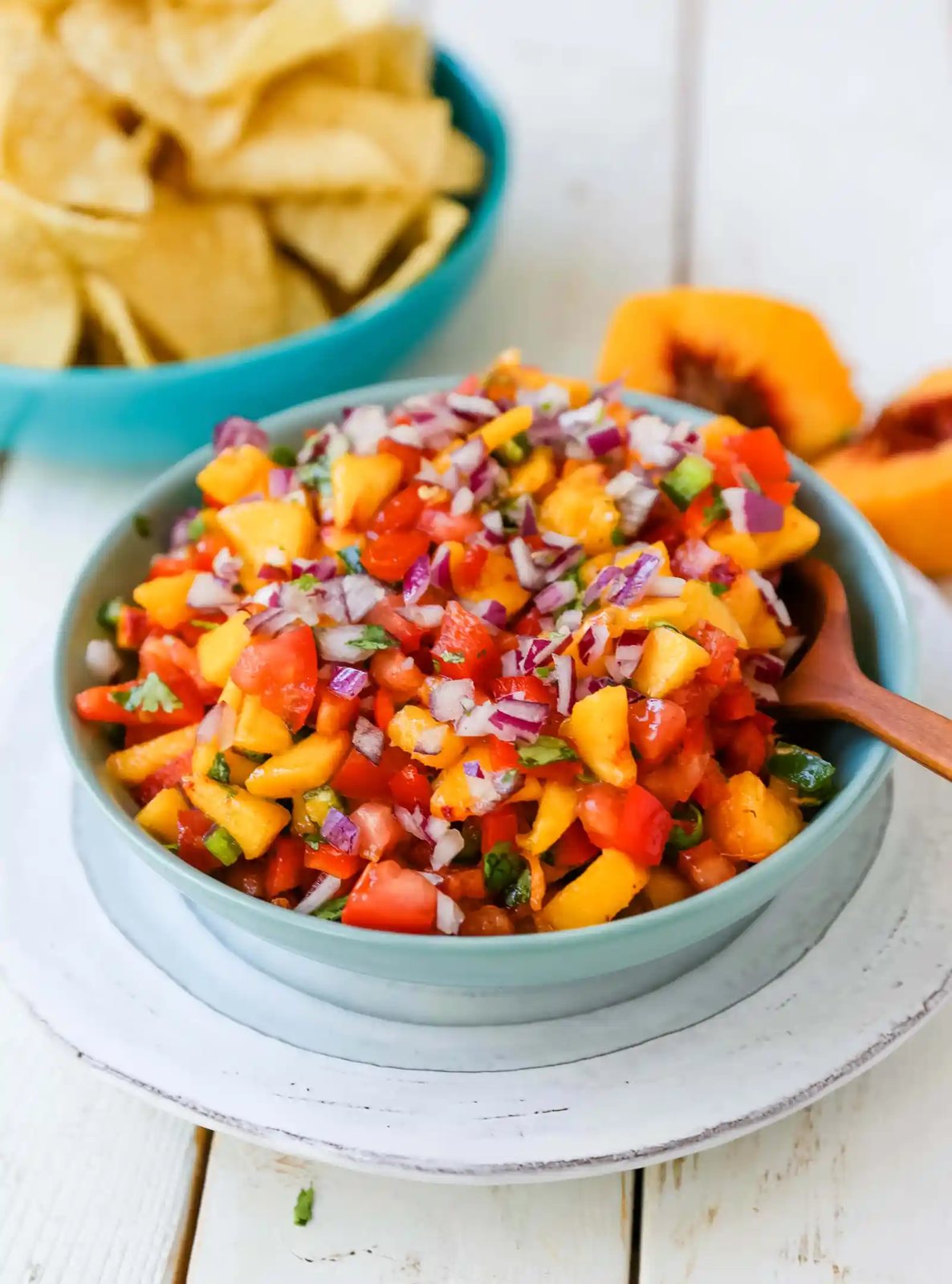 Peach Salsa. Fresh peach salsa with red pepper, jalapeño, red onion, tomatoes, cilantro, and fresh lime juice. A sweet and savory salsa perfect to pair with chips, grilled chicken or pork. www.modernhoney.com #peachsalsa #salsa #peachrecipes