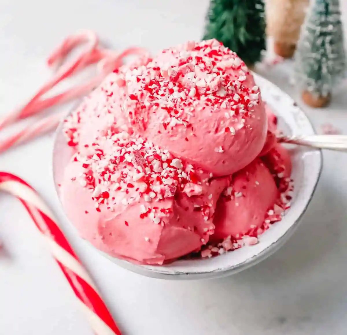 Creamy Homemade Peppermint Ice Cream made with heavy cream, milk, sugar, peppermint extract, and crushed candy canes (or peppermint bark for homemade peppermint bark ice cream). This is the best peppermint ice cream recipe!