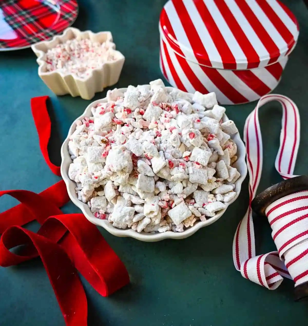 Peppermint Puppy Chow, also known as Peppermint Muddy Buddies, Peppermint Chex Mix, or Peppermint Bark Muddy Buddies, is a festive and addictive holiday treat. It is a variation of the classic Muddy Buddies, but is made with Rice Chex cereal, white chocolate, peppermint bark or candy canes, and powdered sugar.