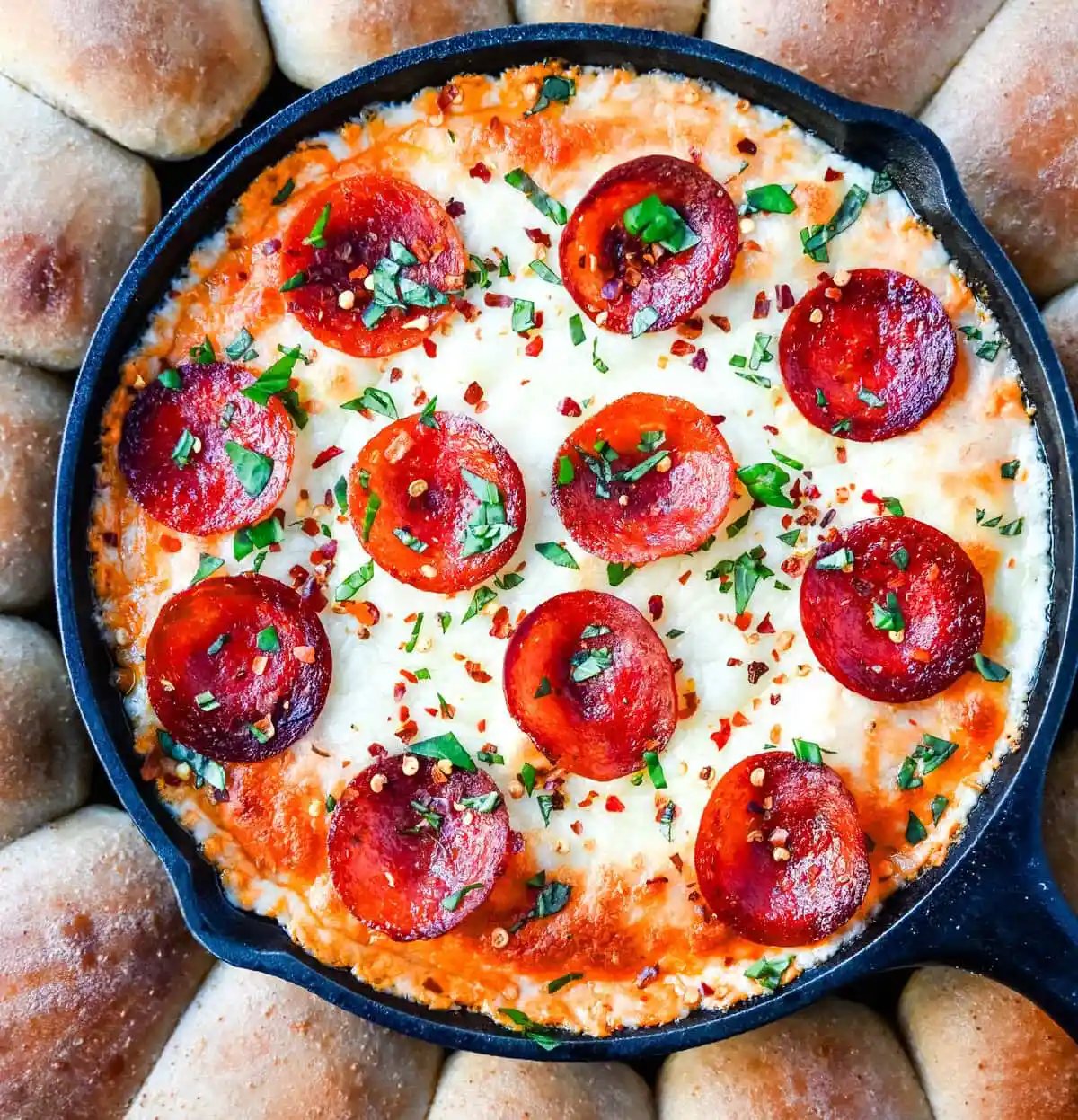 Hot Pepperoni Pizza Dip is a delicious and cheesy appetizer that brings all the classic pizza flavors. Loaded with melted cheeses, tangy marinara sauce, creamy cream cheese, and plenty of crispy pepperoni, this party dip is perfect for game days, potlucks, or get-togethers. It’s an easy appetizer recipe that can be whipped up in no time with minimal effort. The hot pepperoni pizza dip pairs well with homemade pizza dough rolls.