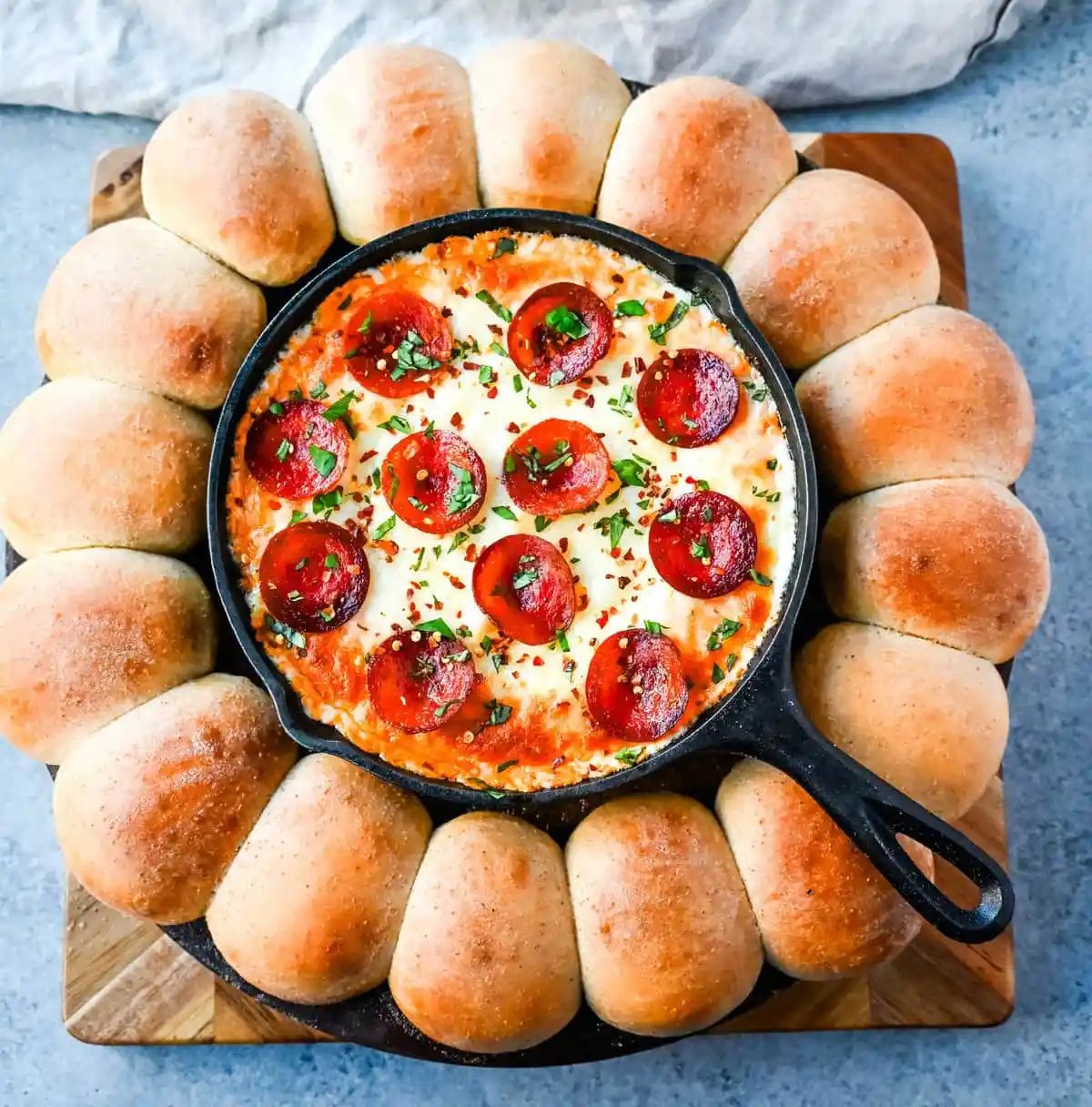 Hot Pepperoni Pizza Dip is a delicious and cheesy appetizer that brings all the classic pizza flavors. Loaded with melted cheeses, tangy marinara sauce, creamy cream cheese, and plenty of crispy pepperoni, this party dip is perfect for game days, potlucks, or get-togethers. It’s an easy appetizer recipe that can be whipped up in no time with minimal effort. The hot pepperoni pizza dip pairs well with homemade pizza dough rolls.
