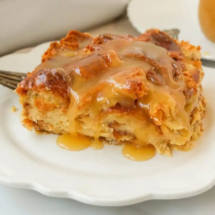 Croissant Bread Pudding with Vanilla Sauce is made with croissants baked in a custard sauce and topped with a homemade vanilla bean sauce. The most decadent dessert or breakfast recipe!