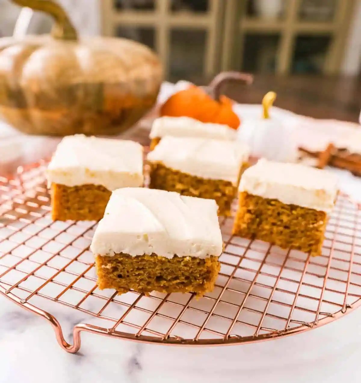 Pumpkin Bars with Cream Cheese Frosting are moist, pumpkin spiced bars topped with homemade sweet cream cheese frosting. The best pumpkin bar recipe!