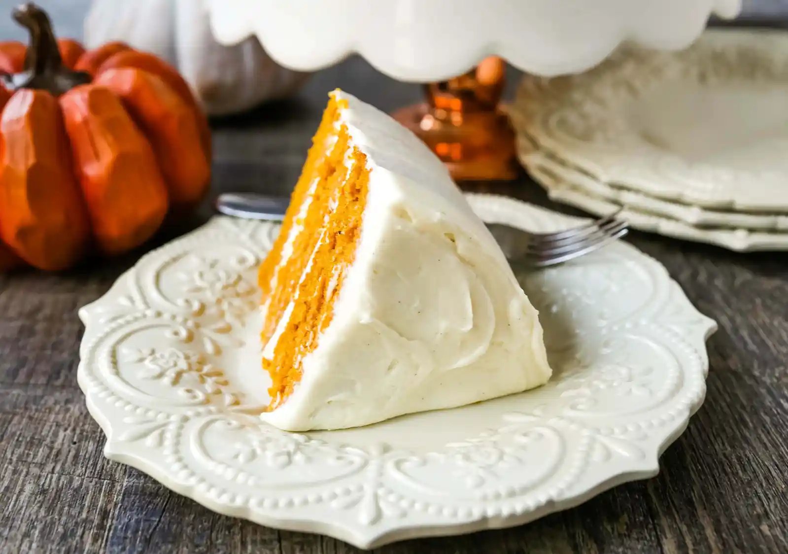 Pumpkin Cake with Cream Cheese Frosting Moist Pumpkin Spiced Cake with a Sweet Cream Cheese Frosting. The best Fall pumpkin layered cake recipe! www.modernhoney.com #pumpkin #pumpkinrecipes #fall #ffallrecipes #pumpkincake