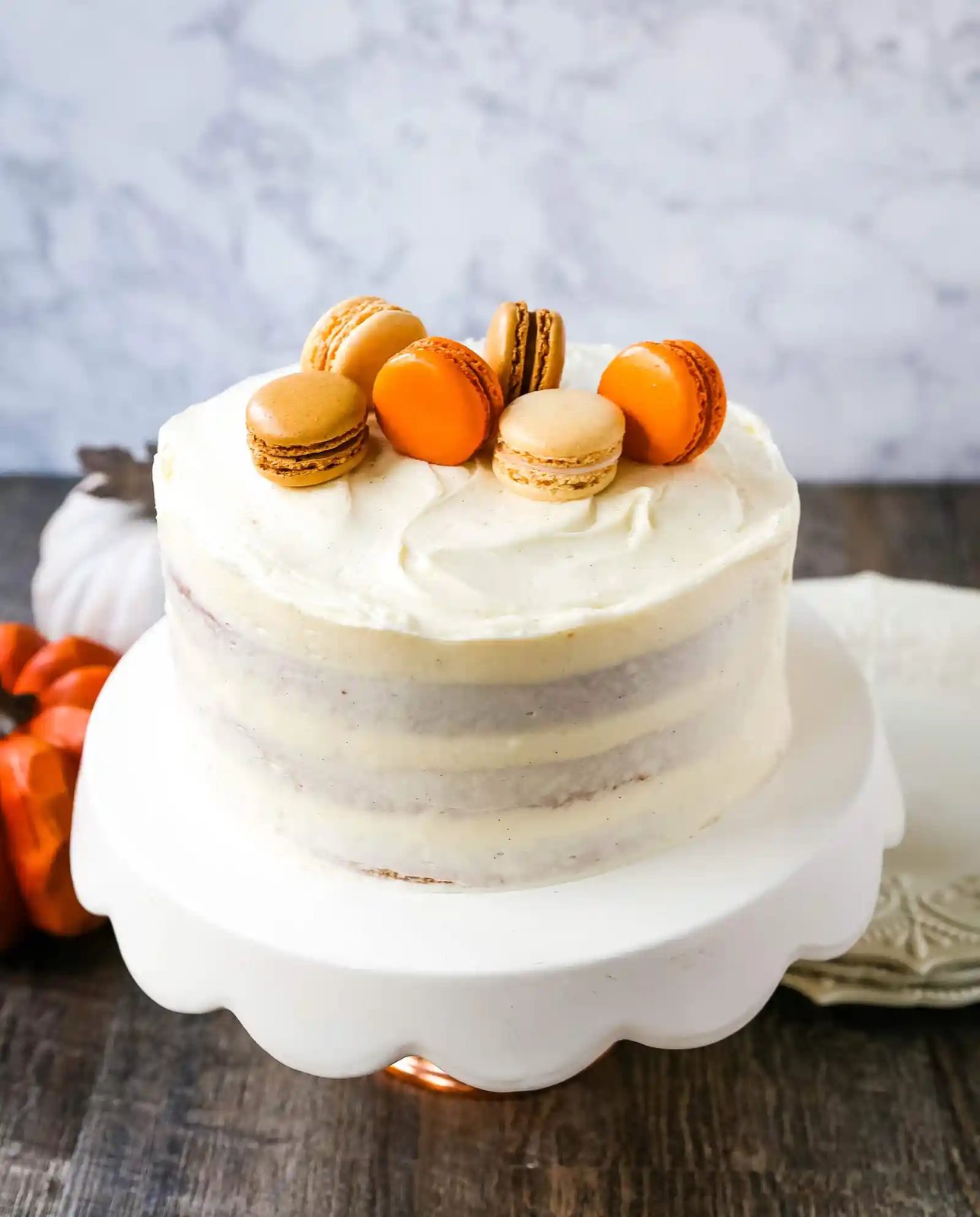 Pumpkin Cake with Cream Cheese Frosting Moist Pumpkin Spiced Cake with a Sweet Cream Cheese Frosting. The best Fall pumpkin layered cake recipe! www.modernhoney.com #pumpkin #pumpkinrecipes #fall #ffallrecipes #pumpkincake