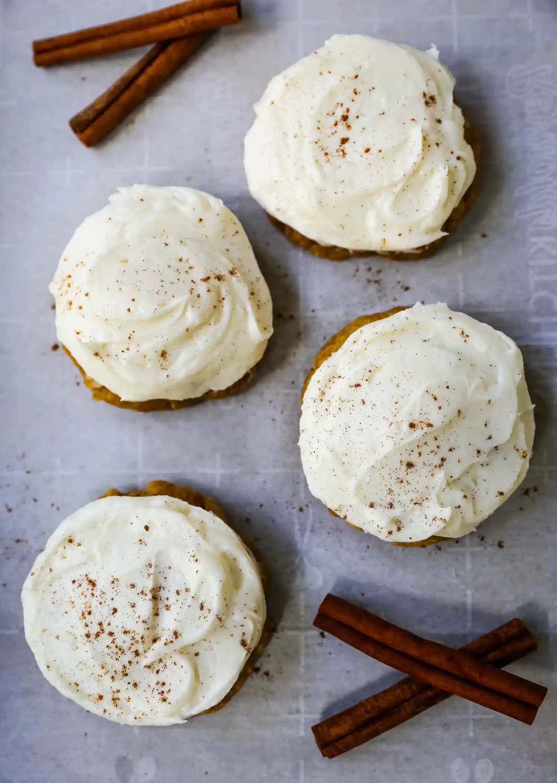 The BEST PUMPKIN COOKIES with CREAM CHEESE FROSTING Soft chewy pumpkin spiced cookies with a fluffy sweet cream cheese frosting. The perfect frosted pumpkin cookie recipe! www.modernhoney.com #pumpkin #pumpkincookies #frostedpumpkincookies #fall #fallrecipes