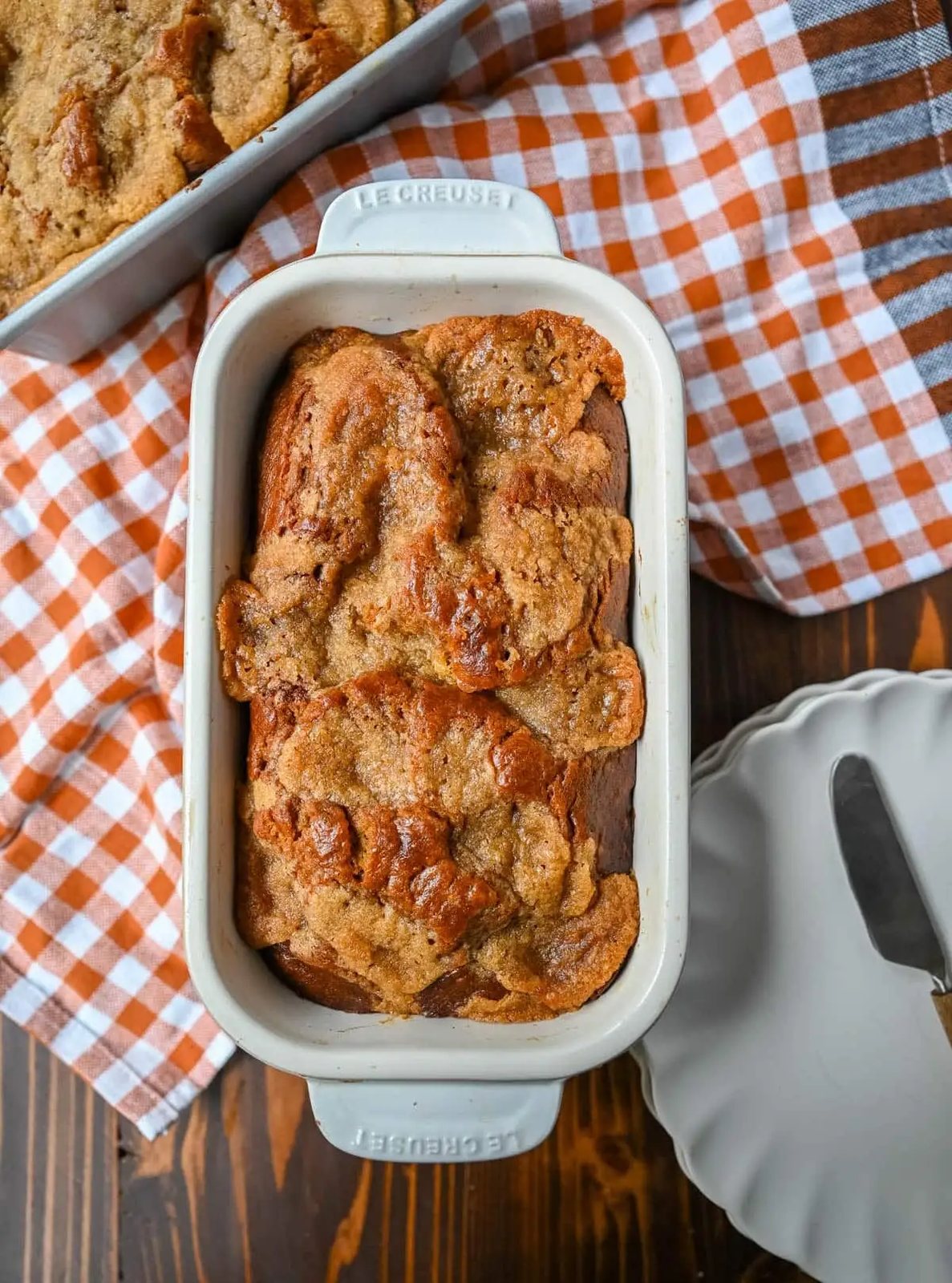 This pumpkin cream cheese bread has a thick ribbon of tangy cheesecake running through the middle, a buttery brown sugar streusel on top, and one simple trick that gives it the deepest, richest pumpkin flavor you've had in a loaf. This is the best pumpkin cream cheese bread recipe and it makes two loaves.