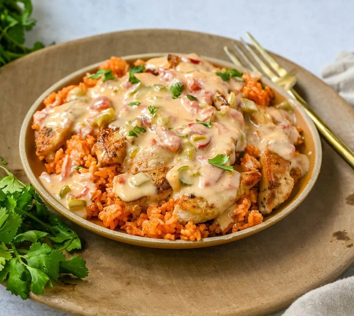 This Queso Smothered Chicken is a comforting, flavor-packed meal that makes everyone at the table ask for seconds — Pollo con Queso is it. This dish brings together juicy sautéed chicken, homemade Spanish rice, and a rich, creamy queso sauce made from scratch. A hearty, cheesy, restaurant-style dish you can make right at home — and better than takeout.