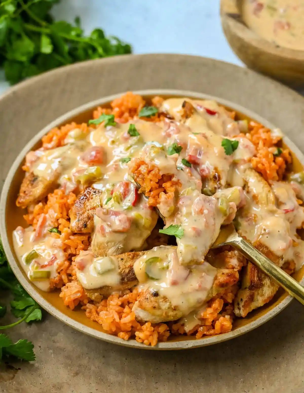 This Queso Smothered Chicken is a comforting, flavor-packed meal that makes everyone at the table ask for seconds — Pollo con Queso is it. This dish brings together juicy sautéed chicken, homemade Spanish rice, and a rich, creamy queso sauce made from scratch. A hearty, cheesy, restaurant-style dish you can make right at home — and better than takeout.