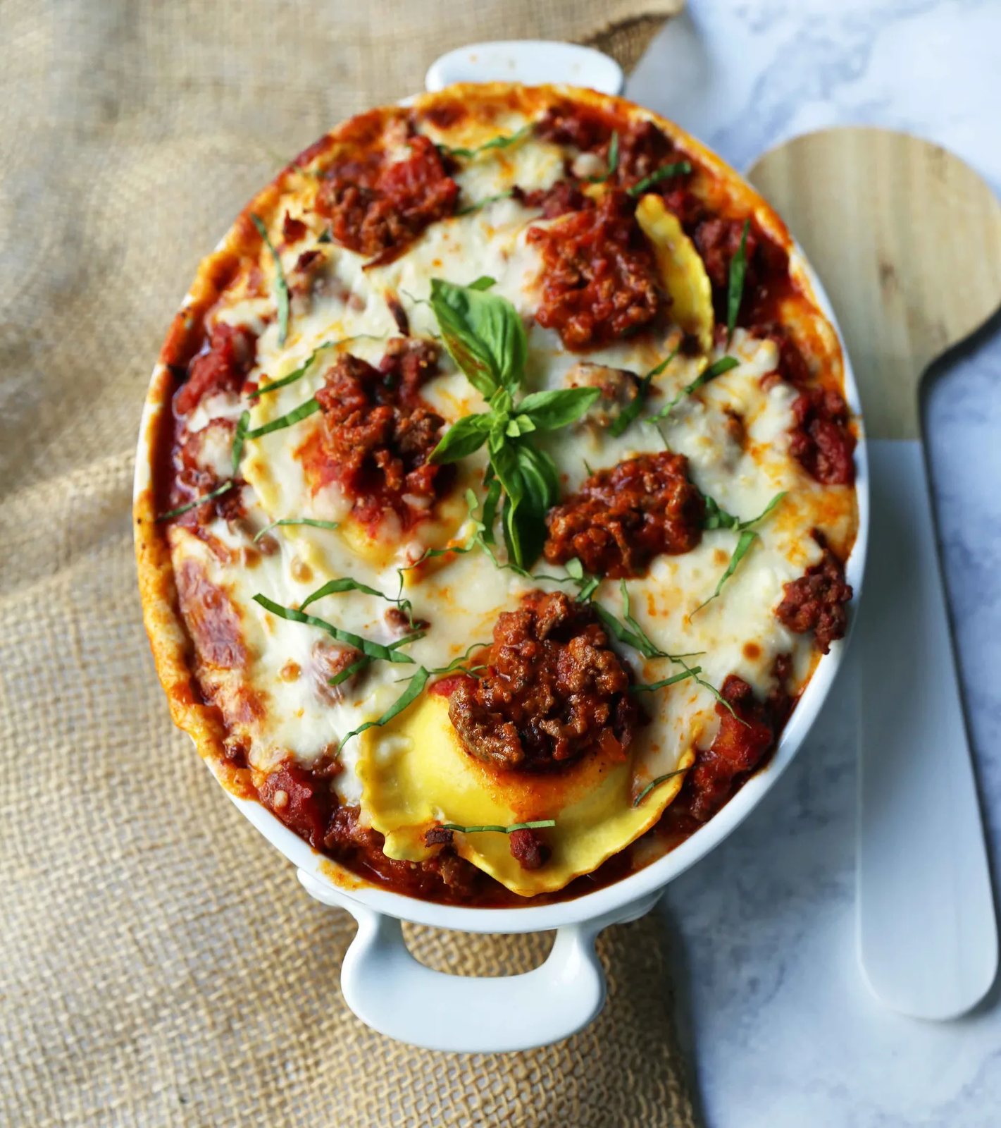 Ravioli Lasagna. Quick and Easy Lasagna Recipe made with cheese ravioli, meat sauce, and melted mozzarella cheese. How to make the best ravioli lasagna. www.modernhoney.com #lasagna #italian #italianfood #ravioli #dinner #dinnerrecipe
