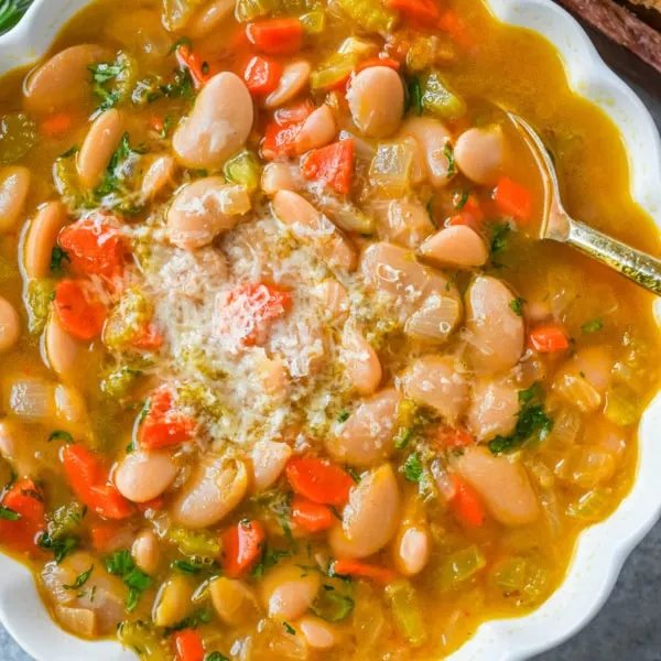 Tuscan White Bean Soup is a hearty Italian soup made with white beans, vegetables, garlic, herbs, and savory broth. It’s simple to make, incredibly comforting, and packed with protein and fiber. You will love this healthy white bean soup recipe!