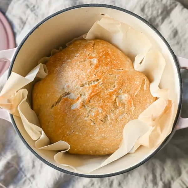 No Knead Overnight Crusty Bread Recipe. This No Knead Bread is baked in a dutch oven and is the perfect crusty french bread recipe. This makes a beautiful artisan loaf of bread and is so easy! The only ingredients you need are flour, water, salt, and yeast for the perfect overnight crusty bread.