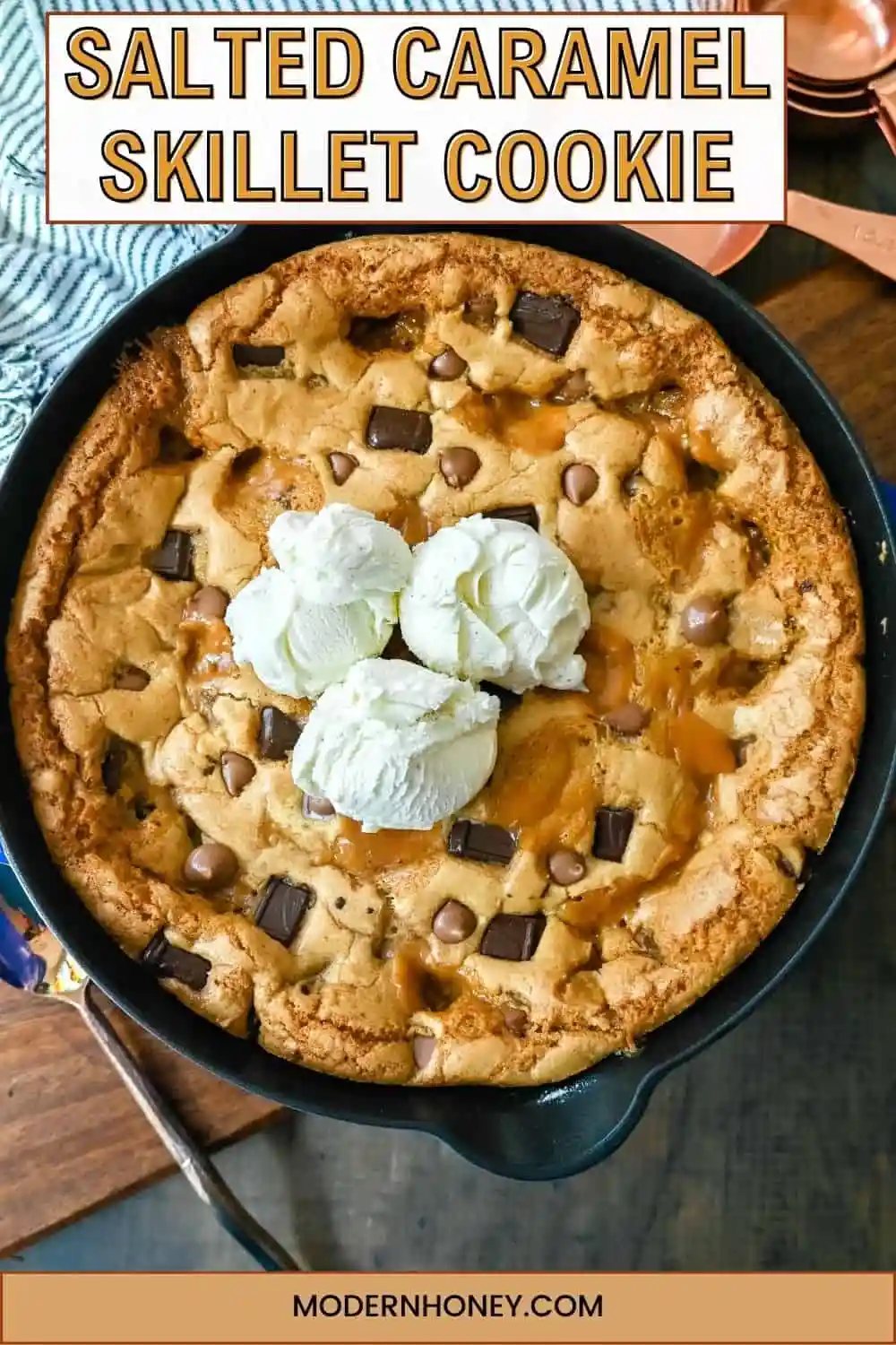 This salted caramel chocolate skillet cookie baked in a cast iron skillet and topped with vanilla ice cream has the perfect combination of sweet and salty caramel, and decadent chocolate in a perfectly buttery cookie.