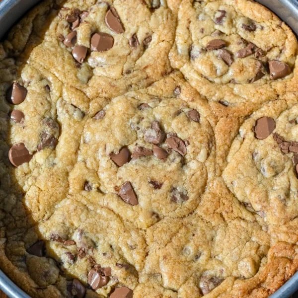 These scoopable cookies are the viral TikTok cookie trend everyone is obsessed with that's soft, gooey, and intentionally slightly underbaked so you can scoop them straight from the pan. Made with classic chocolate chip cookie dough, they bake into a warm, melty, almost brownie-like texture that’s completely irresistible. Instead of perfectly shaped cookies, you get a soft cookie “skillet-style” dessert that’s perfect for spooning and sharing!