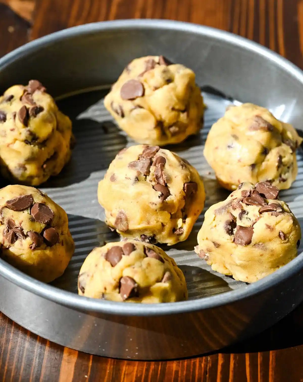 These scoopable cookies are the viral TikTok cookie trend everyone is obsessed with that's soft, gooey, and intentionally slightly underbaked so you can scoop them straight from the pan. Made with classic chocolate chip cookie dough, they bake into a warm, melty, almost brownie-like texture that’s completely irresistible. Instead of perfectly shaped cookies, you get a soft cookie “skillet-style” dessert that’s perfect for spooning and sharing!
