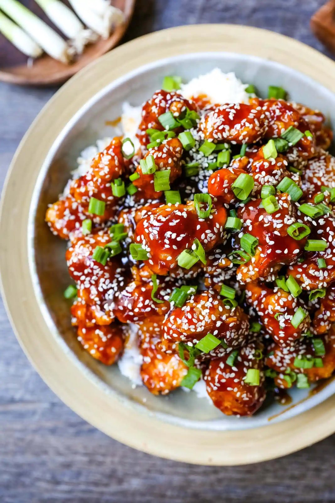 Sesame Chicken. Homemade Chinese Sesame Chicken made with crispy fried chicken covered in a sweet and sour sauce. The ultimate sesame chicken recipe is way better than take-out. www.modernhoney.com #sesamechicken #chinesefood