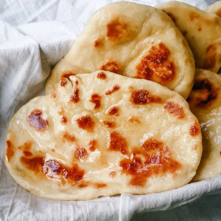 Homemade Naan Bread Light, fluffy, buttery homemade Naan bread that is even better than what you find in restaurants.