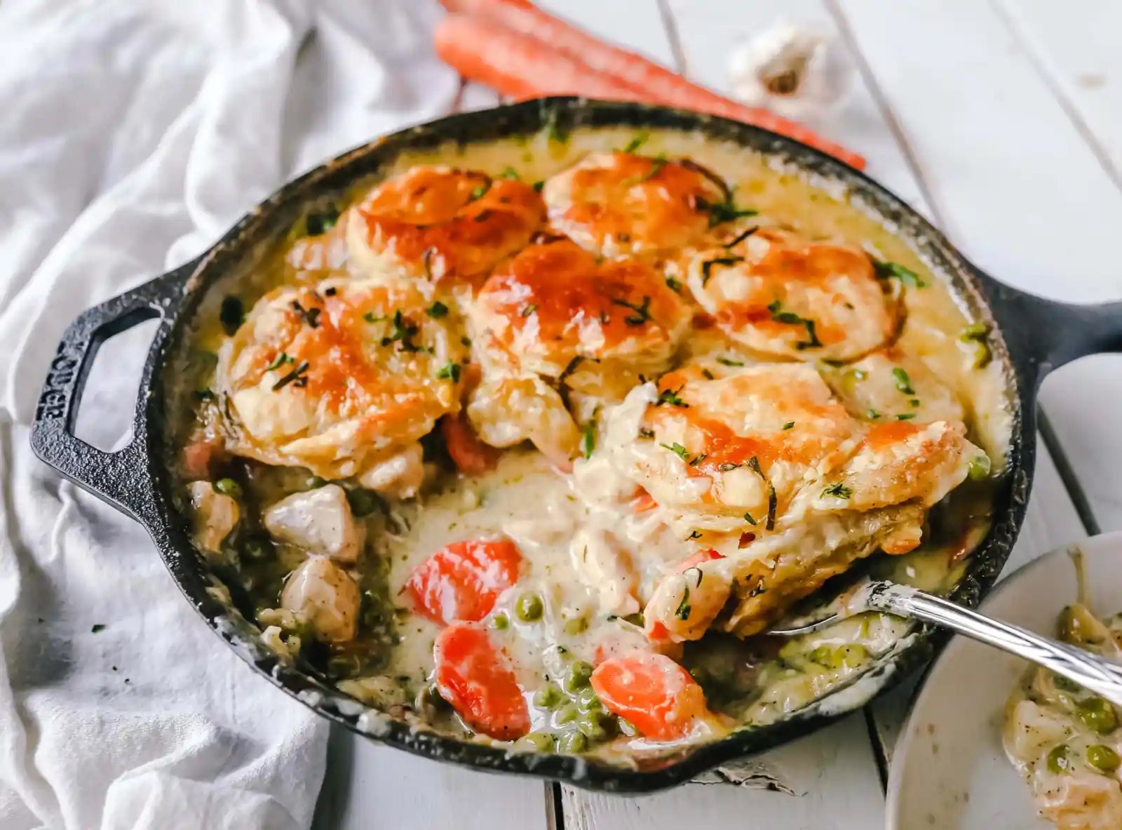 Skillet Chicken Pot Pie Easy, one-skillet chicken pot pie with vegetables baked in a cream sauce and topped with buttery puff pastry. A quick and easy chicken pot pie recipe! www.modernhoney.com #chickenpotpie #potpie #chicken