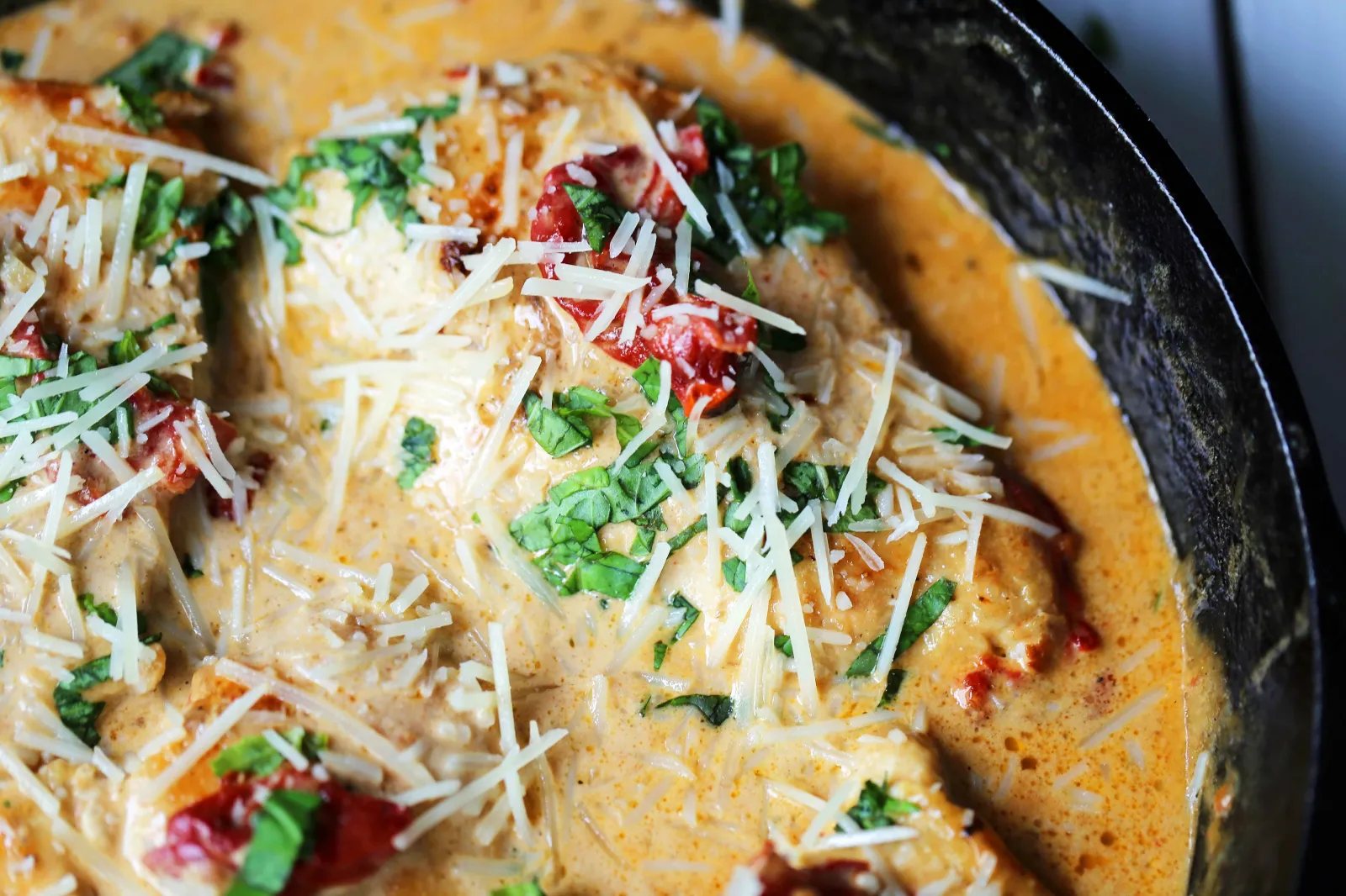 Skillet Chicken with Sun-Dried Tomato Cream Sauce. 20-Minute Chicken made with garlic butter sun-dried tomato parmesan cheese cream sauce. The most flavorful chicken and sauce! You will want to drink the sauce...its THAT GOOD! www.modernhoney.com