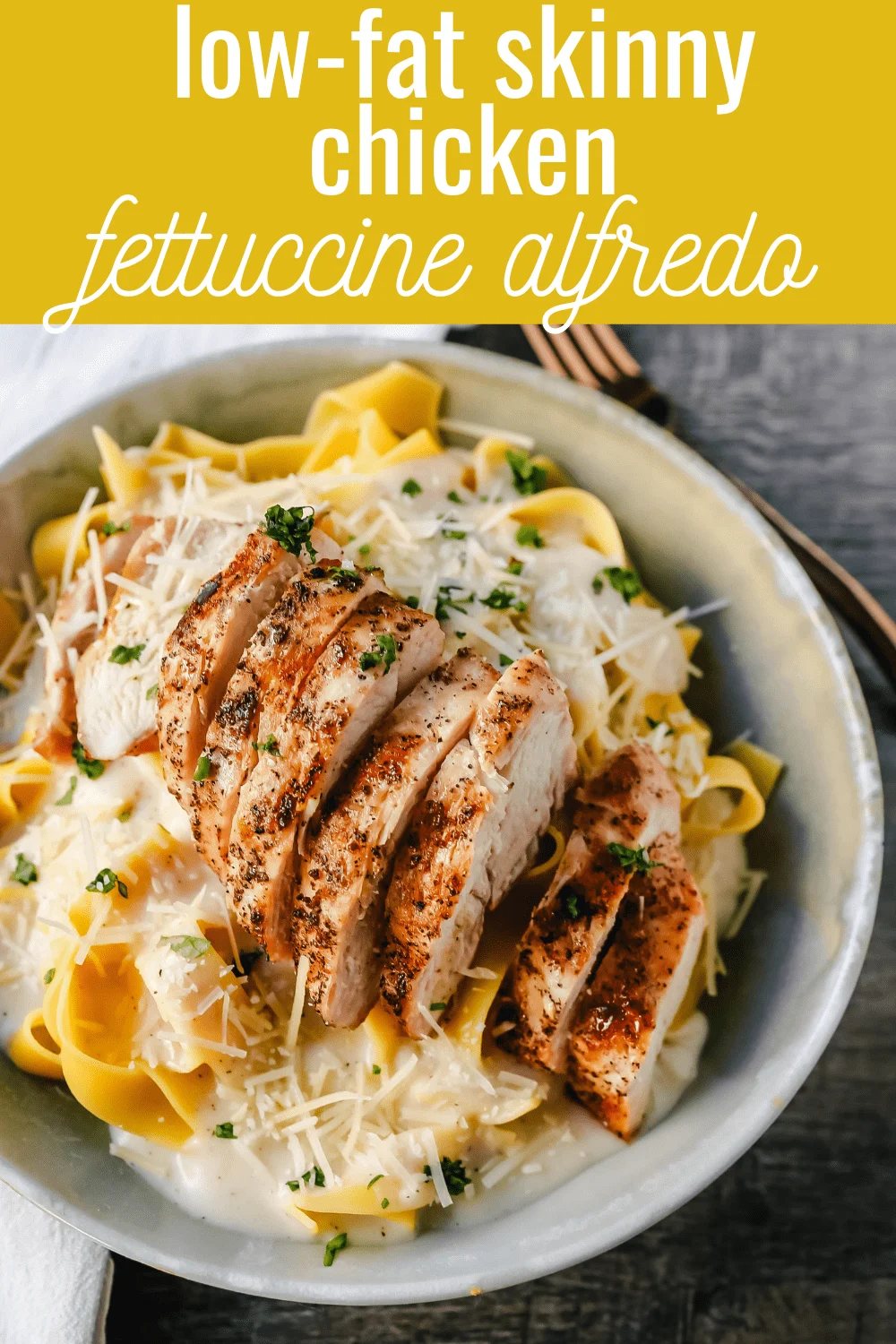 Skinny Low-Fat Chicken Fettuccine Alfredo All of the flavor of Chicken Fettuccine Alfredo without all of the fat and calories! Lean grilled chicken on top of low-fat alfredo sauce tossed with fettuccine noodles. www.modernhoney.com #lowfat #chicken #pasta