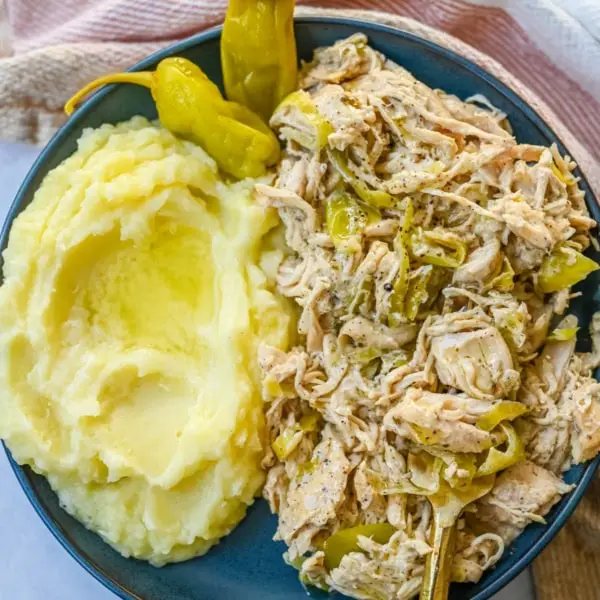 Looking for a new slow cooker chicken recipe? This Slow Cooker Boursin Chicken is rich, creamy, and packed with flavor thanks to garlic herb Boursin cheese, ranch seasoning, and pepperoncini's. The crockpot does all the work, giving you a perfectly tender chicken dinner recipe! You will love this Mississippi Chicken!