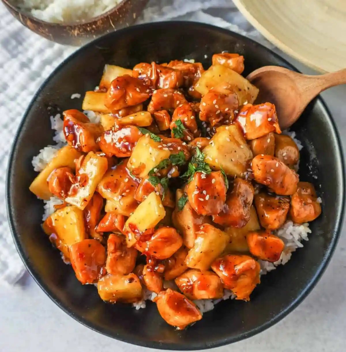 This Sticky Pineapple Chicken is made with chicken tossed in pineapple juice, sweet chili sauce, soy sauce, brown sugar, ginger, and fresh pineapple. This Hawaiian Chicken is perfectly sweet and sticky!