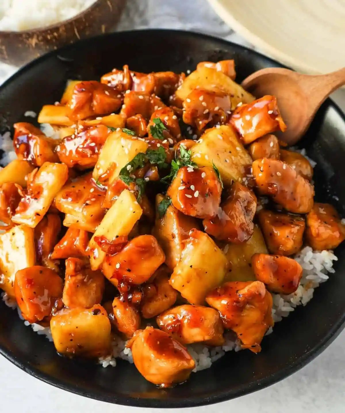 This Sticky Pineapple Chicken is made with chicken tossed in pineapple juice, sweet chili sauce, soy sauce, brown sugar, ginger, and fresh pineapple. This Hawaiian Chicken is perfectly sweet and sticky!