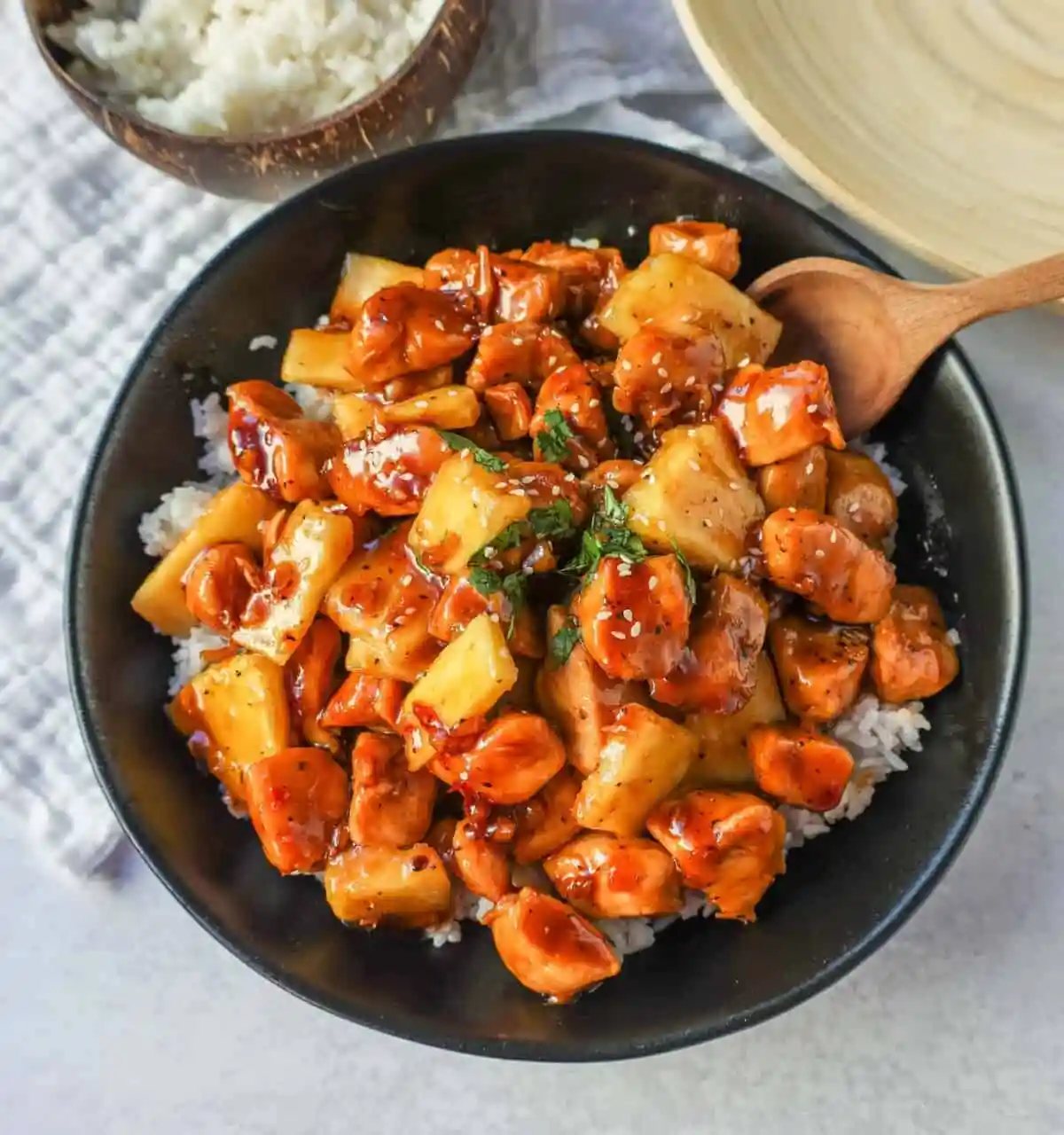 This Sticky Pineapple Chicken is made with chicken tossed in pineapple juice, sweet chili sauce, soy sauce, brown sugar, ginger, and fresh pineapple. This Hawaiian Chicken is perfectly sweet and sticky!
