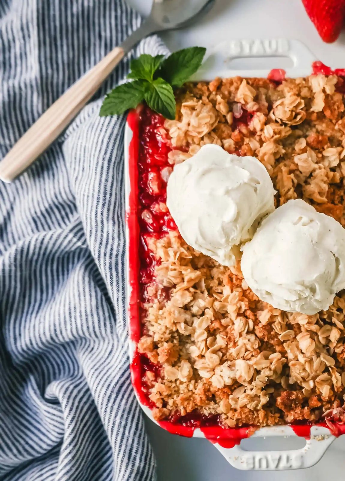 This Strawberry Crisp is made with fresh sweetened strawberries topped with a homemade buttery oat crumble topping. A Homemade Strawberry Crumble is an easy summer dessert.