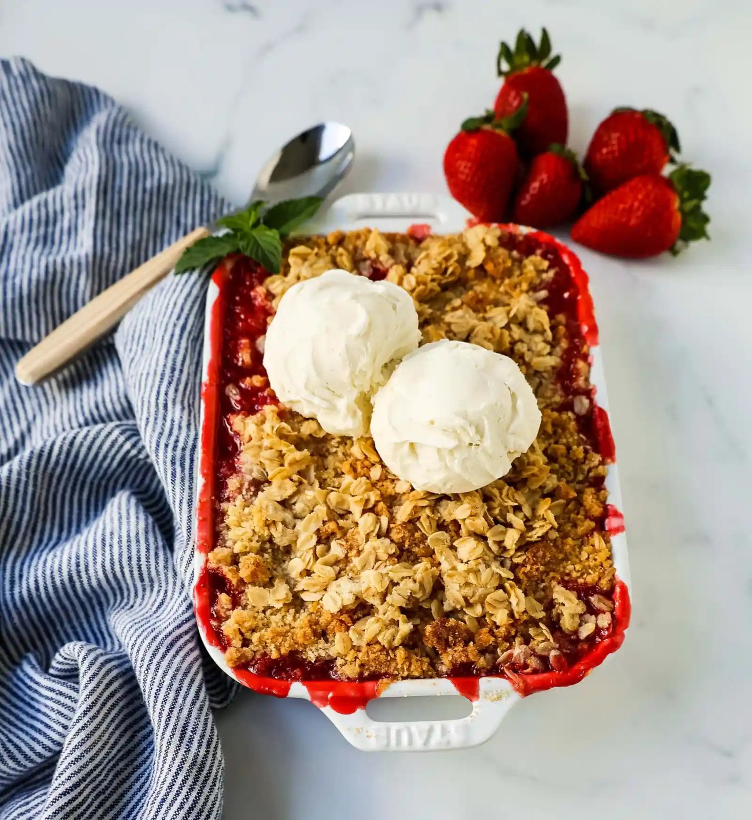 This Strawberry Crisp is made with fresh sweetened strawberries topped with a homemade buttery oat crumble topping. A Homemade Strawberry Crumble is an easy summer dessert.