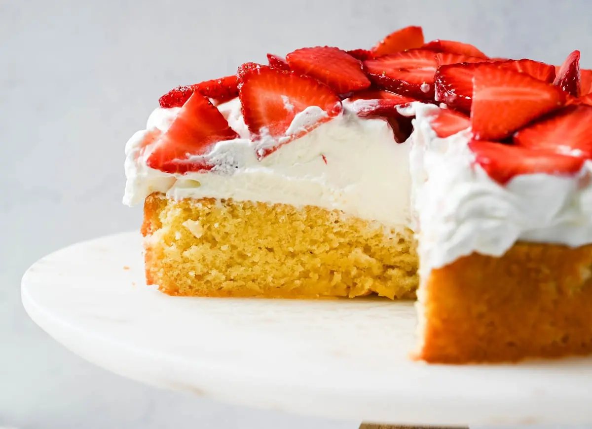 This Strawberry Shortcake Cake is a soft, buttery vanilla cake layered with fluffy homemade whipped cream and juicy strawberries. It’s the perfect spring and summer dessert that tastes like a classic strawberry shortcake but in an easy-to-slice cake form.