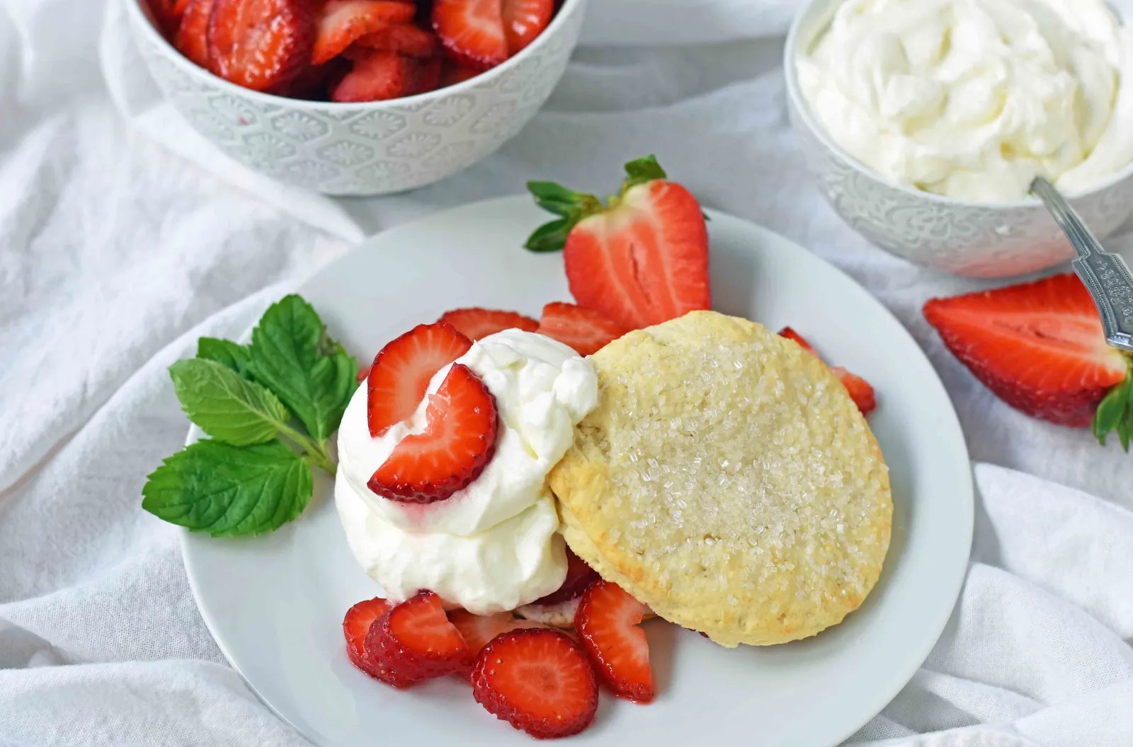 Strawberry Shortcake with Sweet Biscuits, Sugared Strawberries, and Homemade Sweetened Whipped Cream. The BEST Strawberry Shortcake Recipe. A Southern classic Strawberry Shortcake with biscuits. www.modernhoney.com