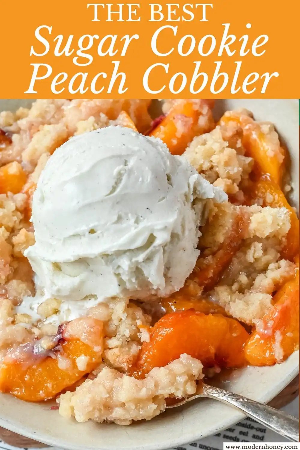This Homemade Sugar Cookie Peach Cobbler is made with juicy peaches tossed in sugar and topped with a soft, buttery sugar cookie crust, then baked until golden. Serve it warm with a scoop of vanilla ice cream for the best peach cobbler recipe with a sugar cookie twist!