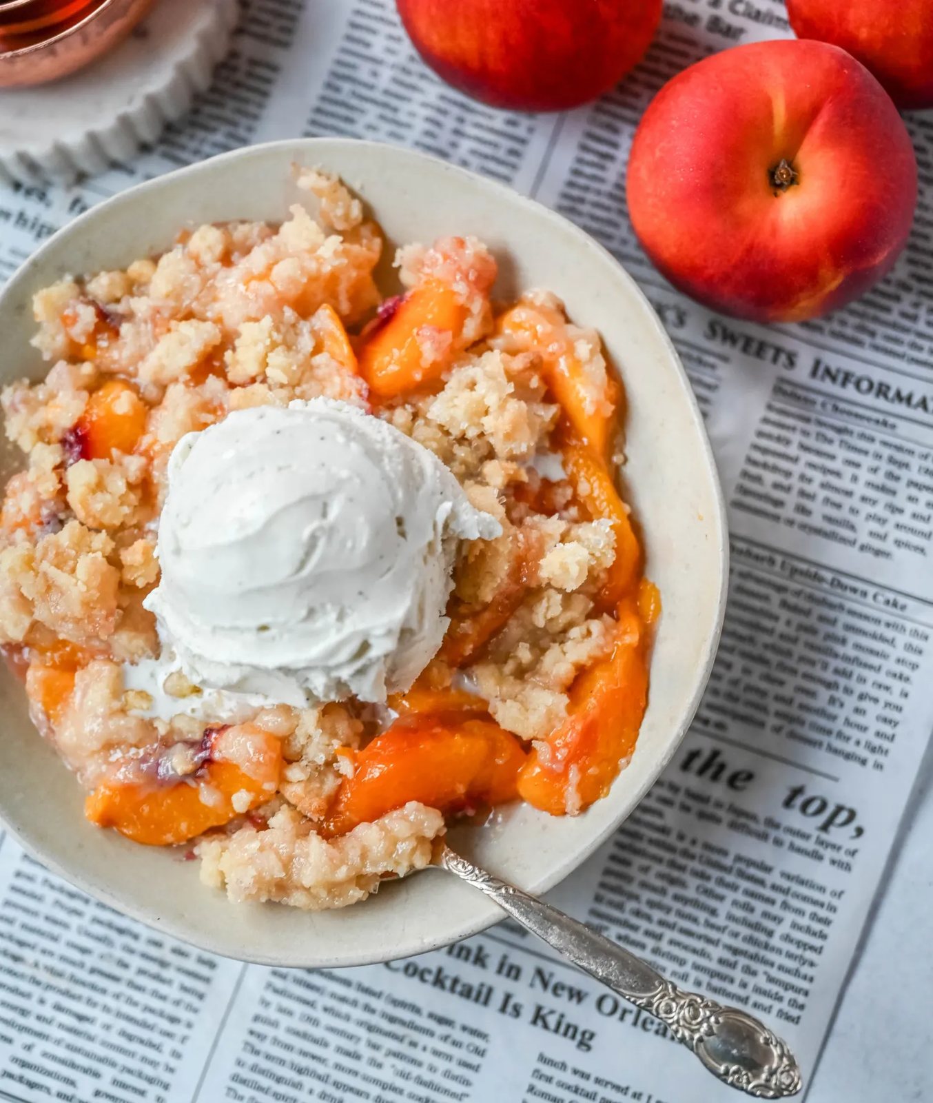 This Homemade Sugar Cookie Peach Cobbler is made with juicy peaches tossed in sugar and topped with a soft, buttery sugar cookie crust, then baked until golden. Serve it warm with a scoop of vanilla ice cream for the best peach cobbler recipe with a sugar cookie twist!