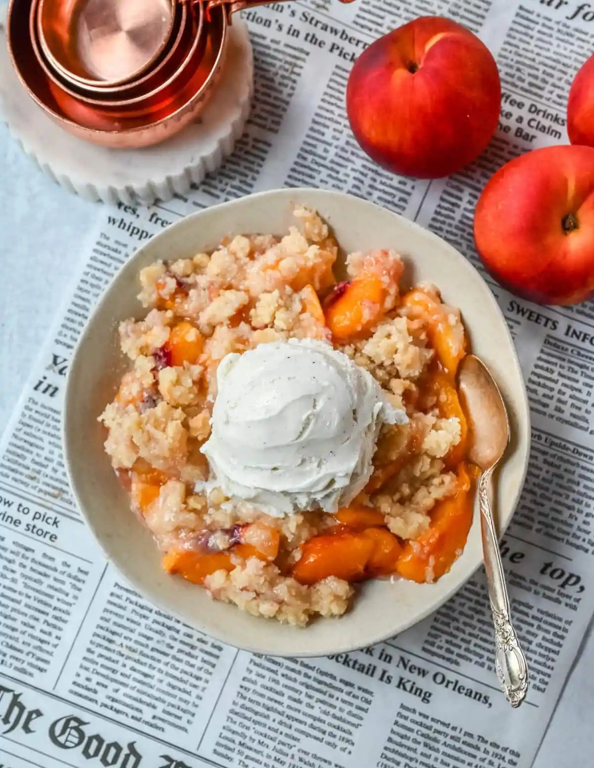 This Homemade Sugar Cookie Peach Cobbler is made with juicy peaches tossed in sugar and topped with a soft, buttery sugar cookie crust, then baked until golden. Serve it warm with a scoop of vanilla ice cream for the best peach cobbler recipe with a sugar cookie twist!