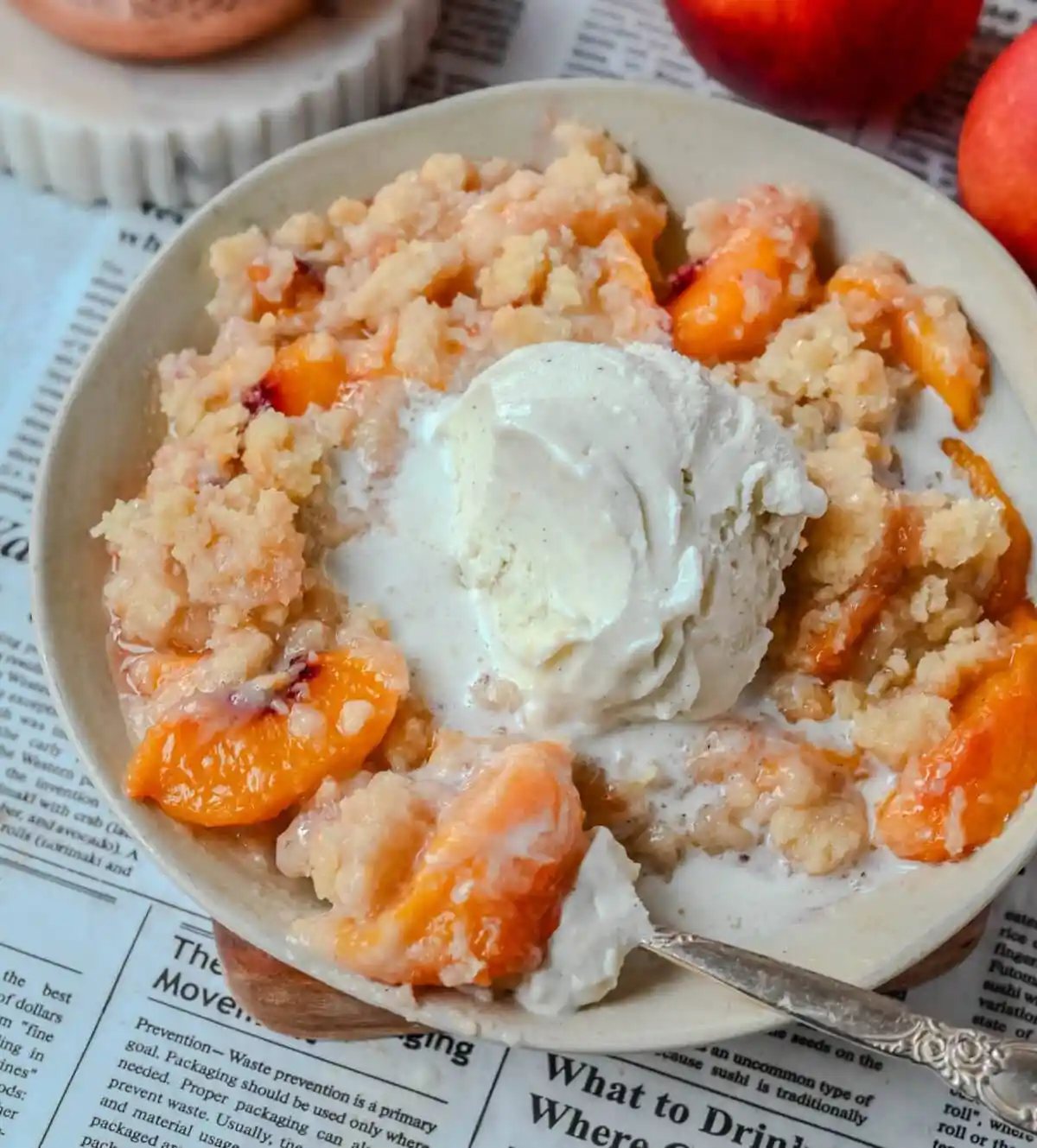 This Homemade Sugar Cookie Peach Cobbler is made with juicy peaches tossed in sugar and topped with a soft, buttery sugar cookie crust, then baked until golden. Serve it warm with a scoop of vanilla ice cream for the best peach cobbler recipe with a sugar cookie twist!