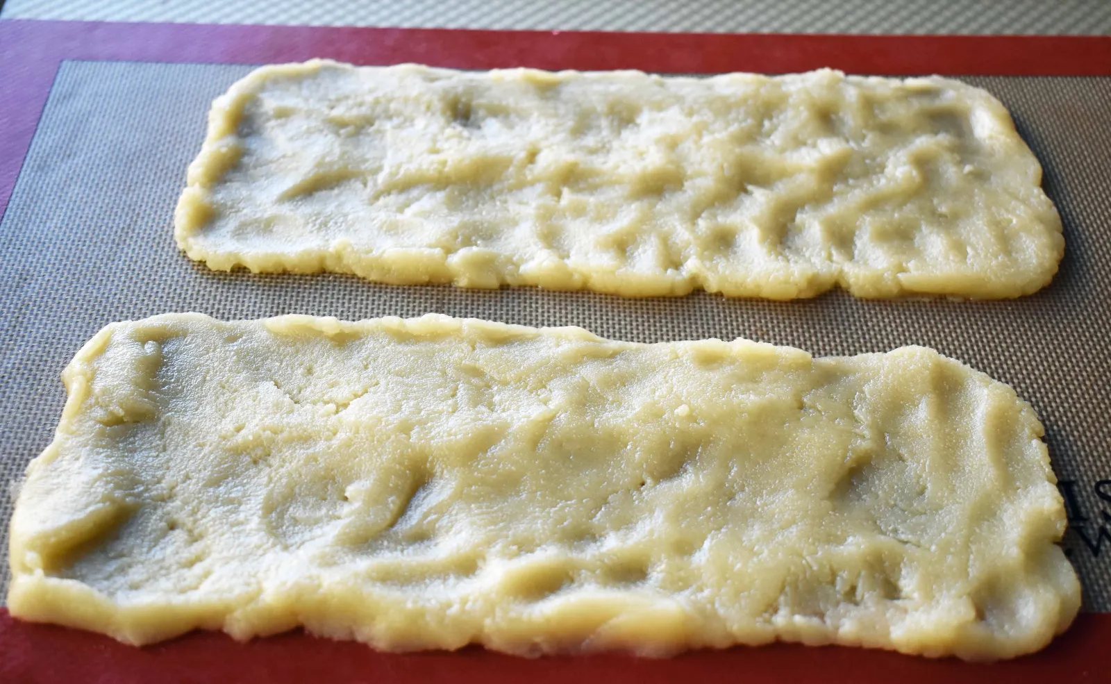 Swedish Pastry by Modern Honey. Buttery flaky layers with almond filling and topped with sweet cream frosting. A popular homemade European pastry.