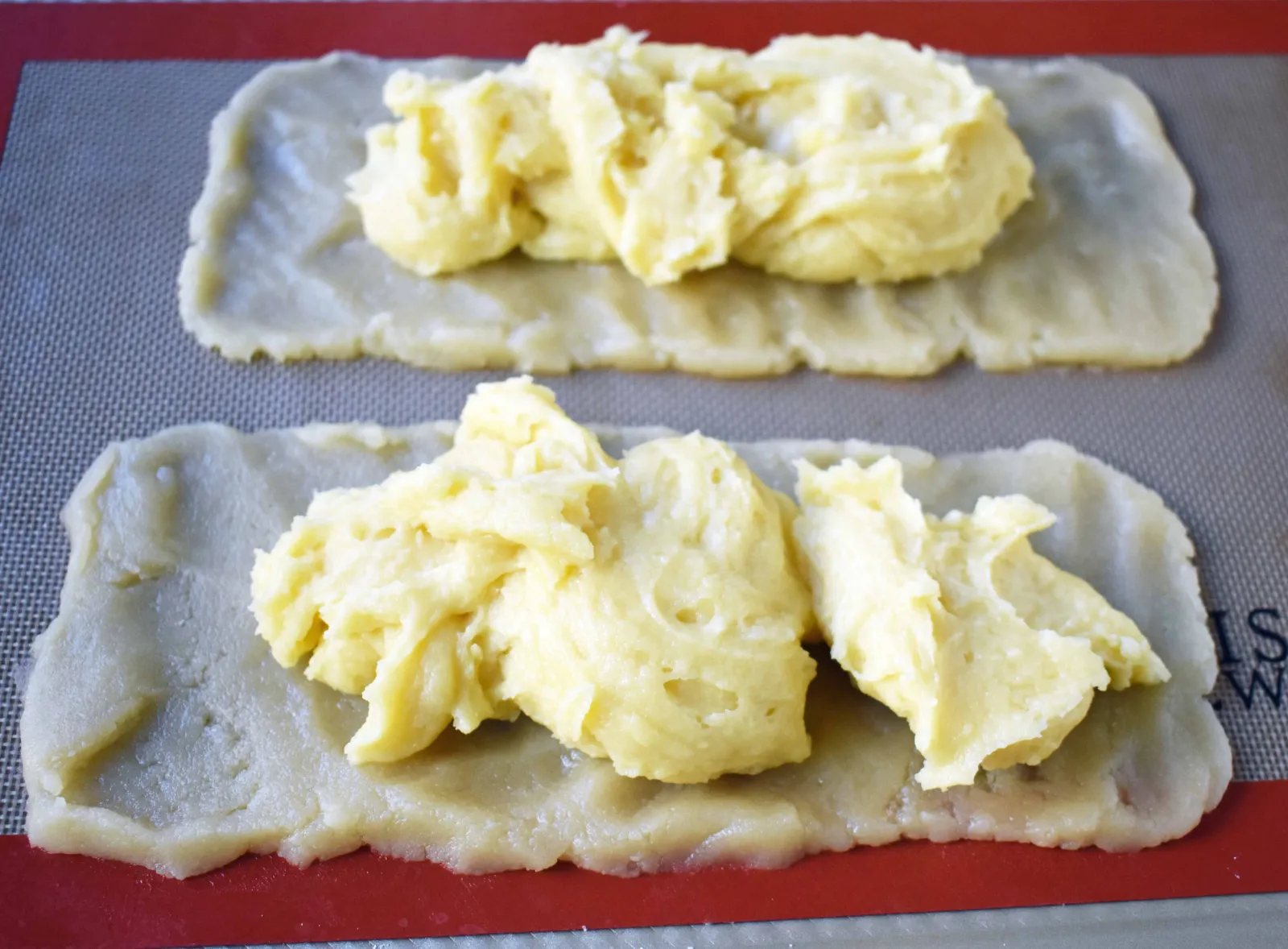 Swedish Pastry by Modern Honey. Buttery flaky layers with almond filling and topped with sweet cream frosting. A popular homemade European pastry.
