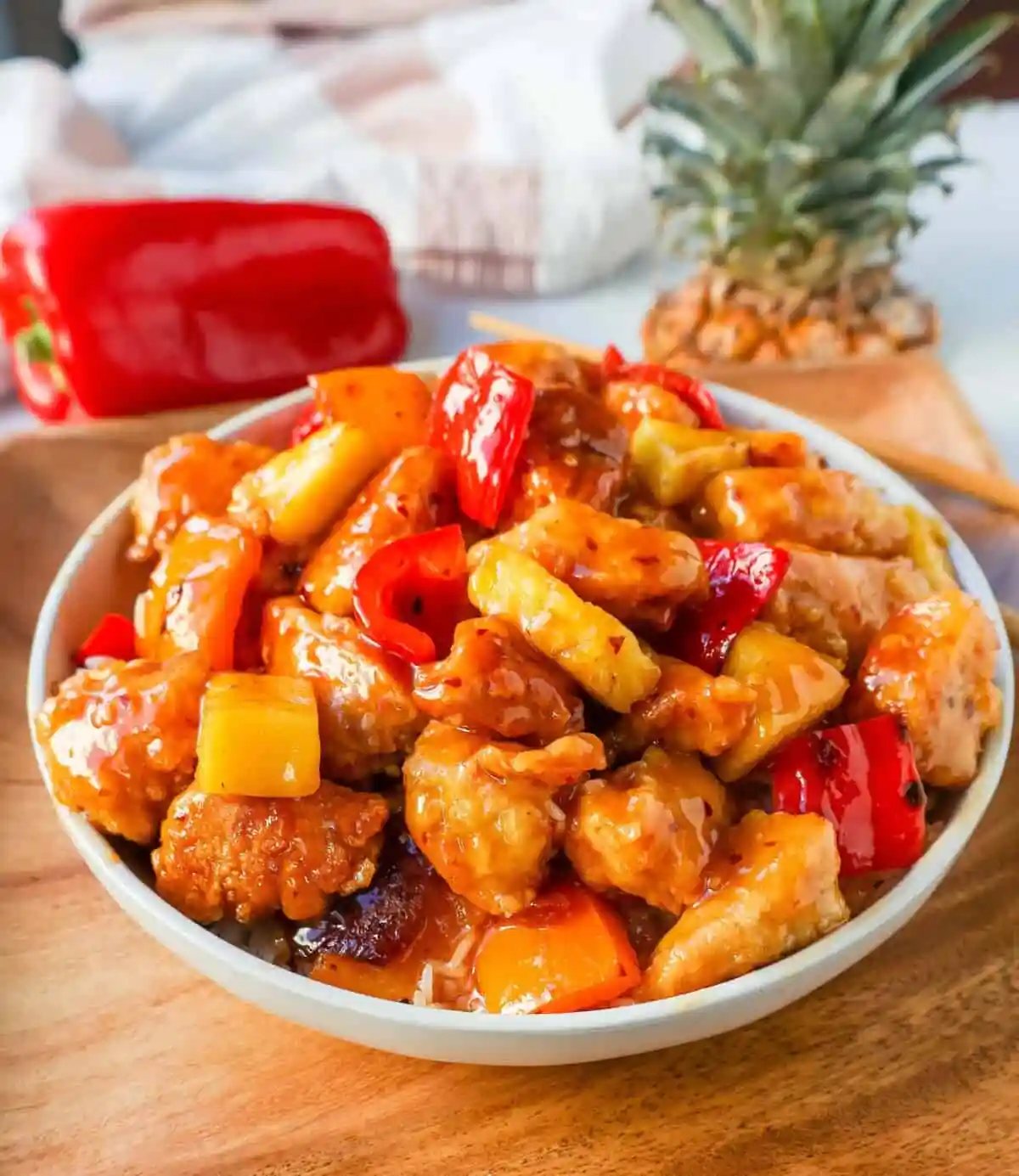 Sweet and Sour Chicken is made with crispy fried chicken covered in a pineapple sweet and sour sauce. The ultimate Sweet and Sour Chicken Recipe is way better than take-out.