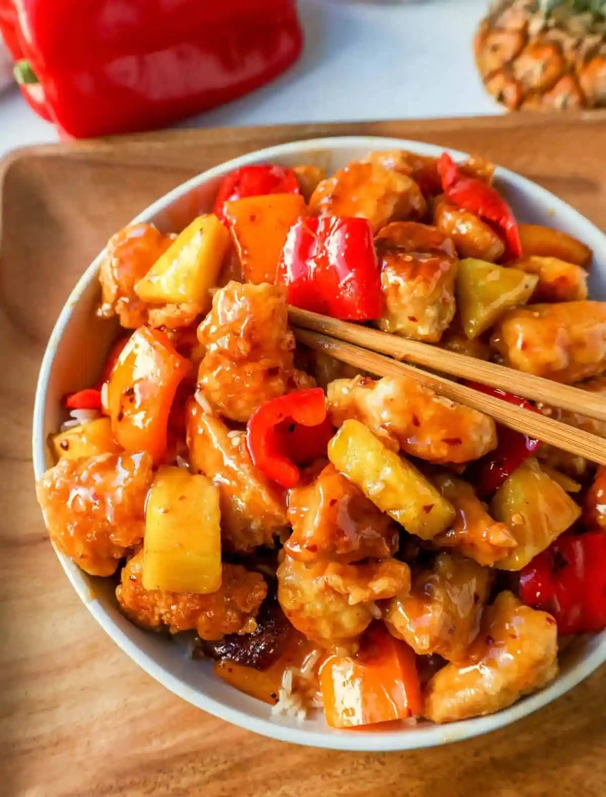 Sweet and Sour Chicken is made with crispy fried chicken covered in a pineapple sweet and sour sauce. The ultimate Sweet and Sour Chicken Recipe is way better than take-out.