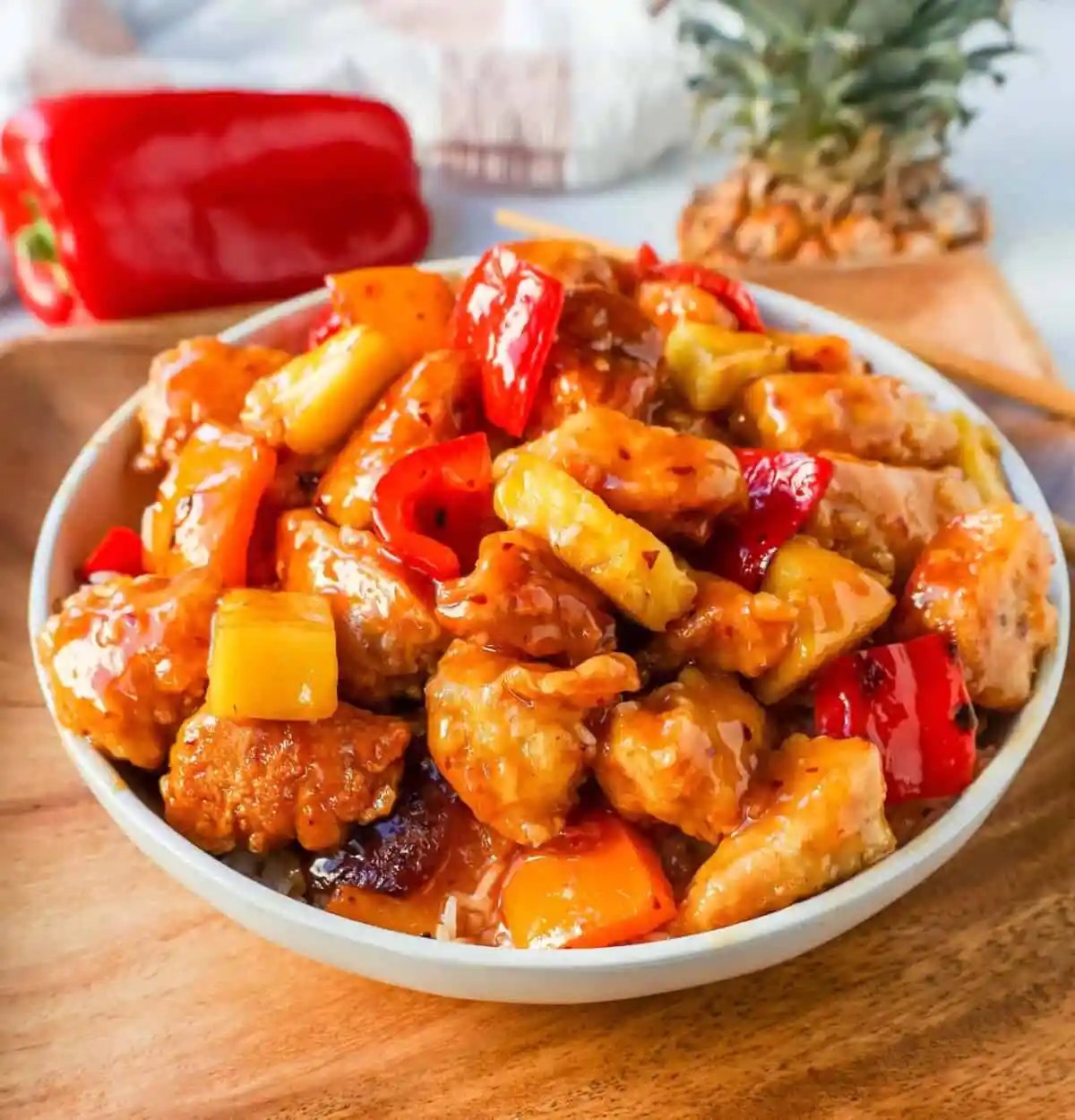 Sweet and Sour Chicken is made with crispy fried chicken covered in a pineapple sweet and sour sauce. The ultimate Sweet and Sour Chicken Recipe is way better than take-out.