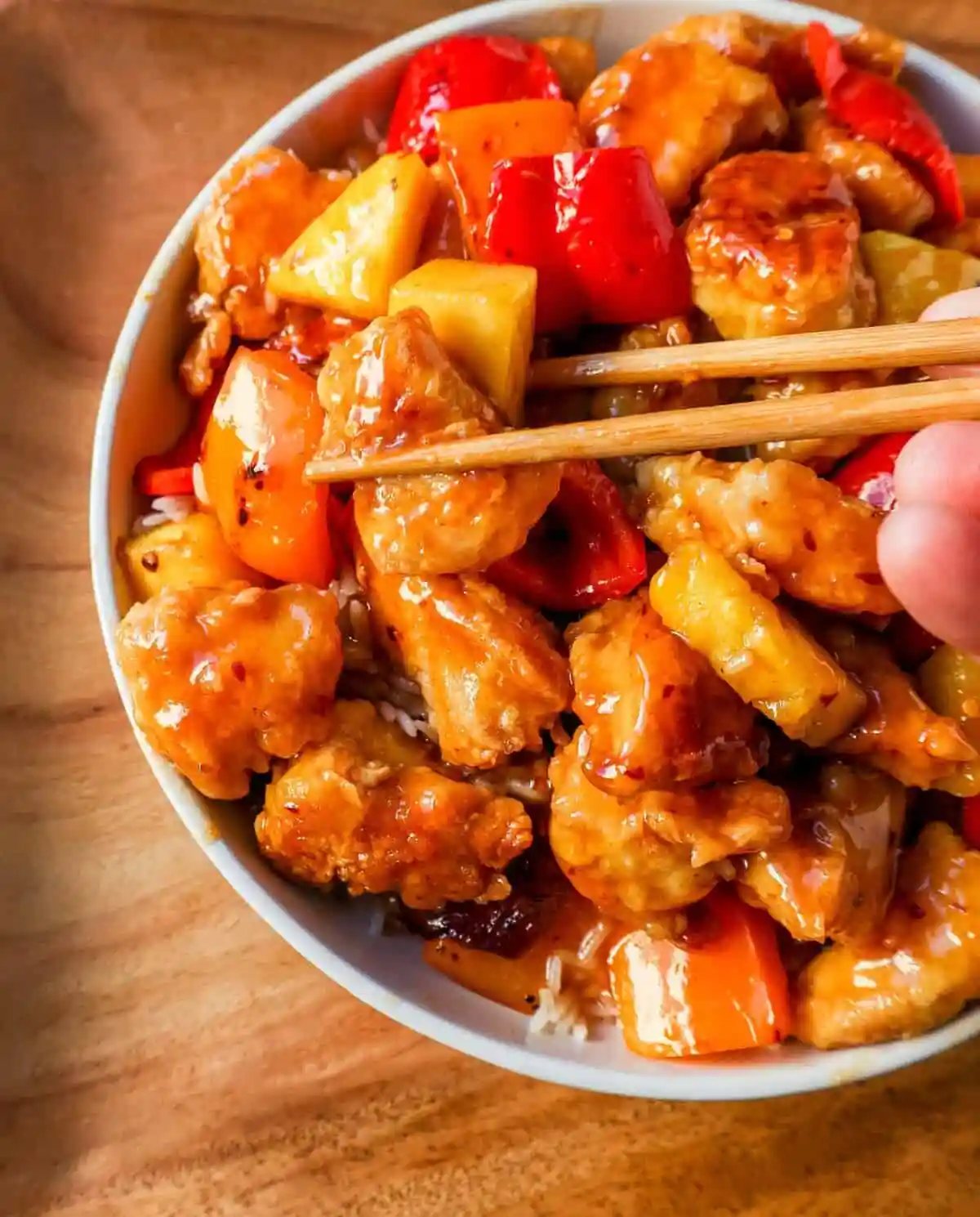 Sweet and Sour Chicken is made with crispy fried chicken covered in a pineapple sweet and sour sauce. The ultimate Sweet and Sour Chicken Recipe is way better than take-out.