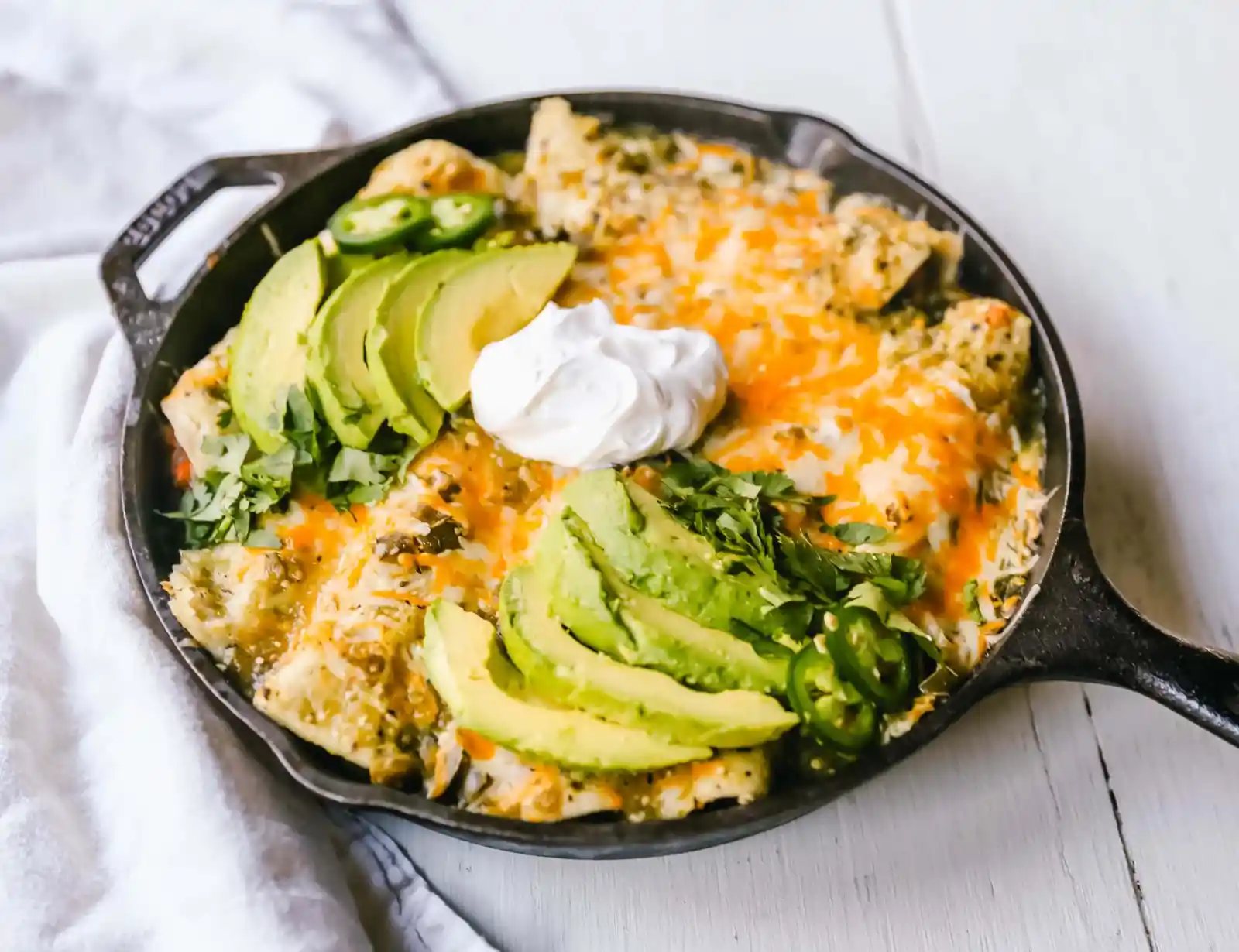 Sweet Potato Black Bean Enchiladas with Salsa Verde Black beans, sweet potatoes, and roasted poblano chilies rolled into corn tortillas and topped with salsa verde and Mexican cheeses. www.modernhoney.com #vegetableenchiladas #enchiladas