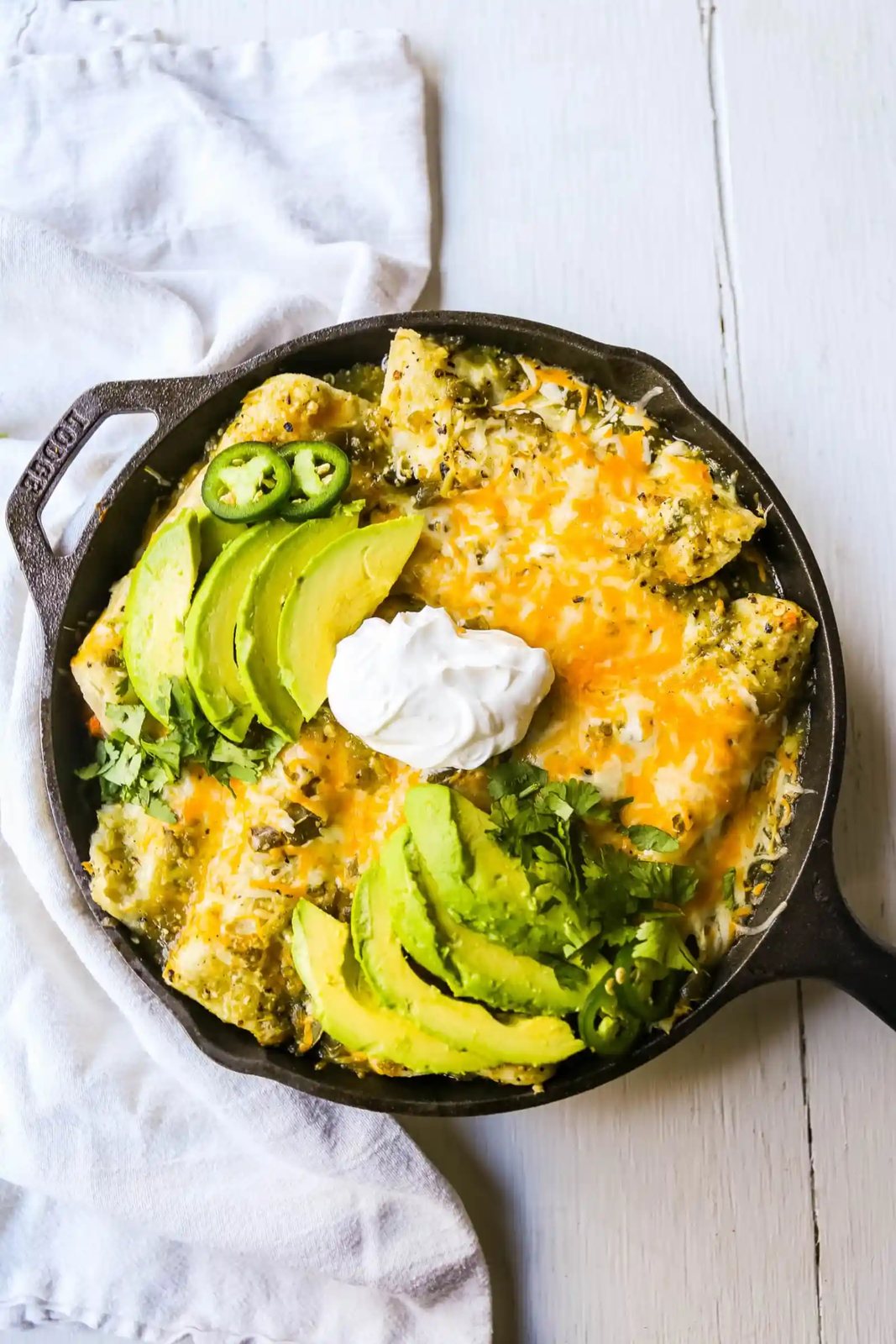 Sweet Potato Black Bean Enchiladas with Salsa Verde Black beans, sweet potatoes, and roasted poblano chilies rolled into corn tortillas and topped with salsa verde and Mexican cheeses. www.modernhoney.com #vegetableenchiladas #enchiladas
