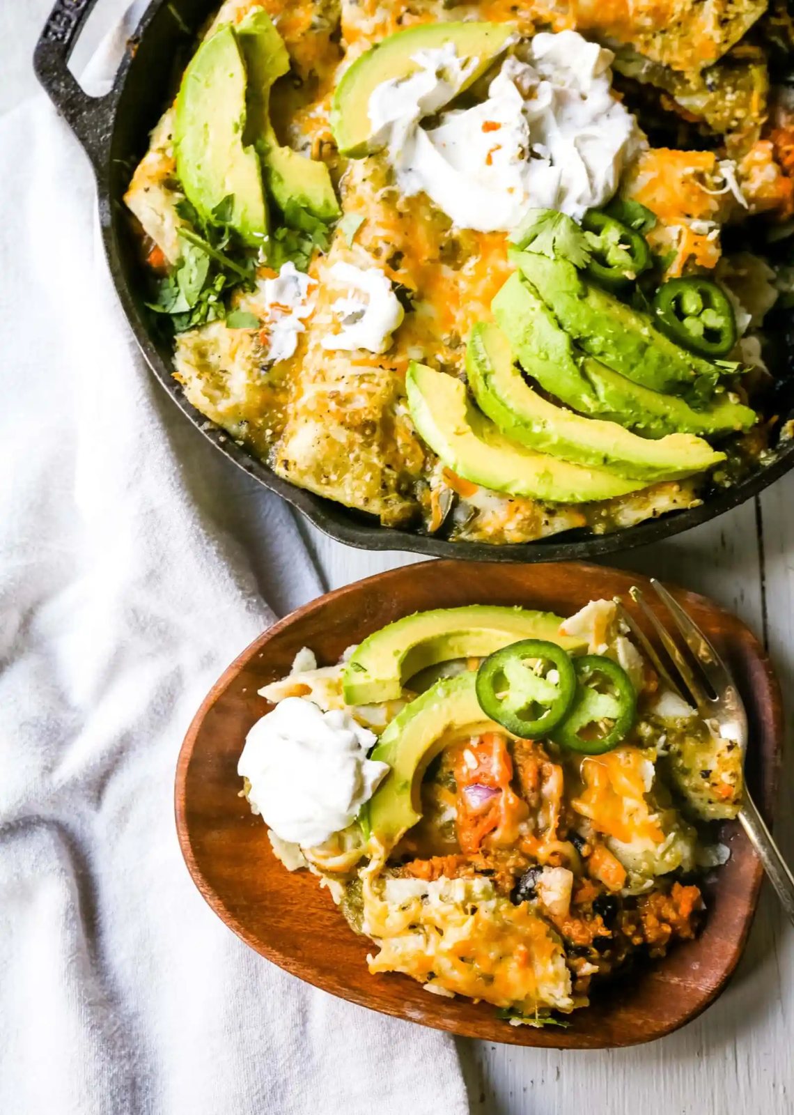 Sweet Potato Black Bean Enchiladas with Salsa Verde Black beans, sweet potatoes, and roasted poblano chilies rolled into corn tortillas and topped with salsa verde and Mexican cheeses. www.modernhoney.com #vegetableenchiladas #enchiladas