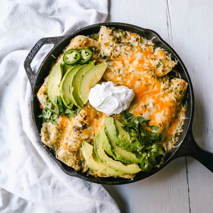 Sweet Potato Black Bean Enchiladas with Salsa Verde Black beans, sweet potatoes, and roasted poblano chilies rolled into corn tortillas and topped with salsa verde and Mexican cheeses. www.modernhoney.com #vegetableenchiladas #enchiladas