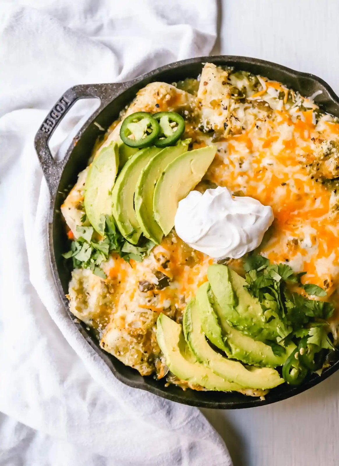 Sweet Potato Black Bean Enchiladas with Salsa Verde Black beans, sweet potatoes, and roasted poblano chilies rolled into corn tortillas and topped with salsa verde and Mexican cheeses. www.modernhoney.com #vegetableenchiladas #enchiladas