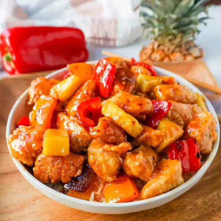 Sweet and Sour Chicken is made with crispy fried chicken covered in a pineapple sweet and sour sauce. The ultimate Sweet and Sour Chicken Recipe is way better than take-out.